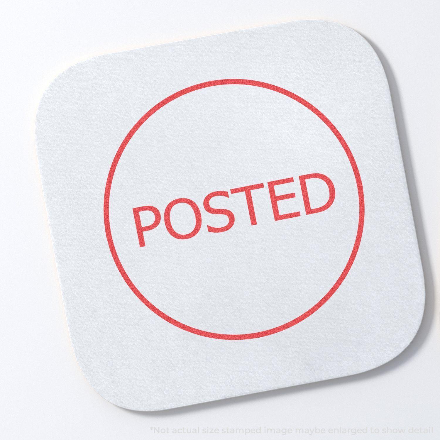 Round Posted Xstamper Stamp imprint on a white square paper, showing the word POSTED in red within a circular border.