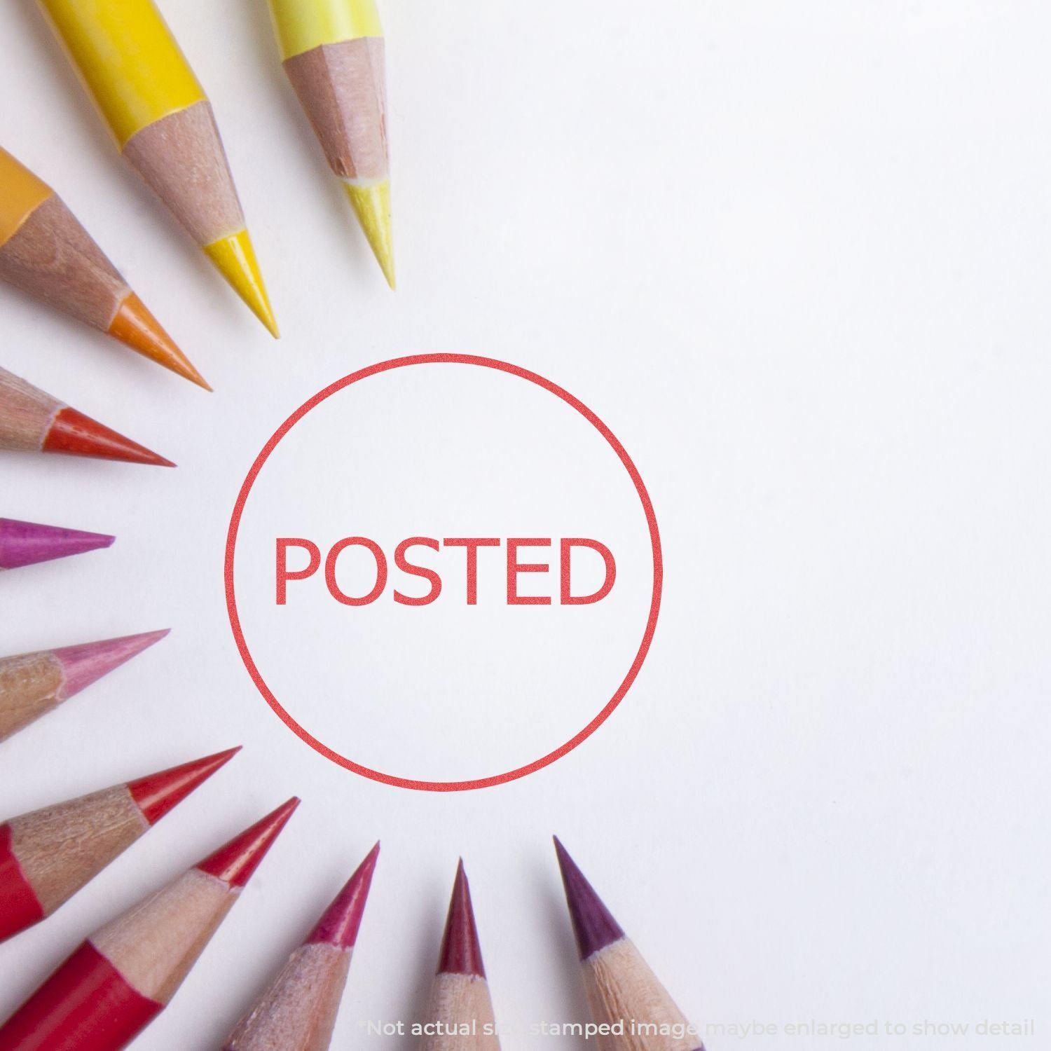 Round Posted Xstamper Stamp imprint in red on white paper, surrounded by colored pencils arranged in a circular pattern.