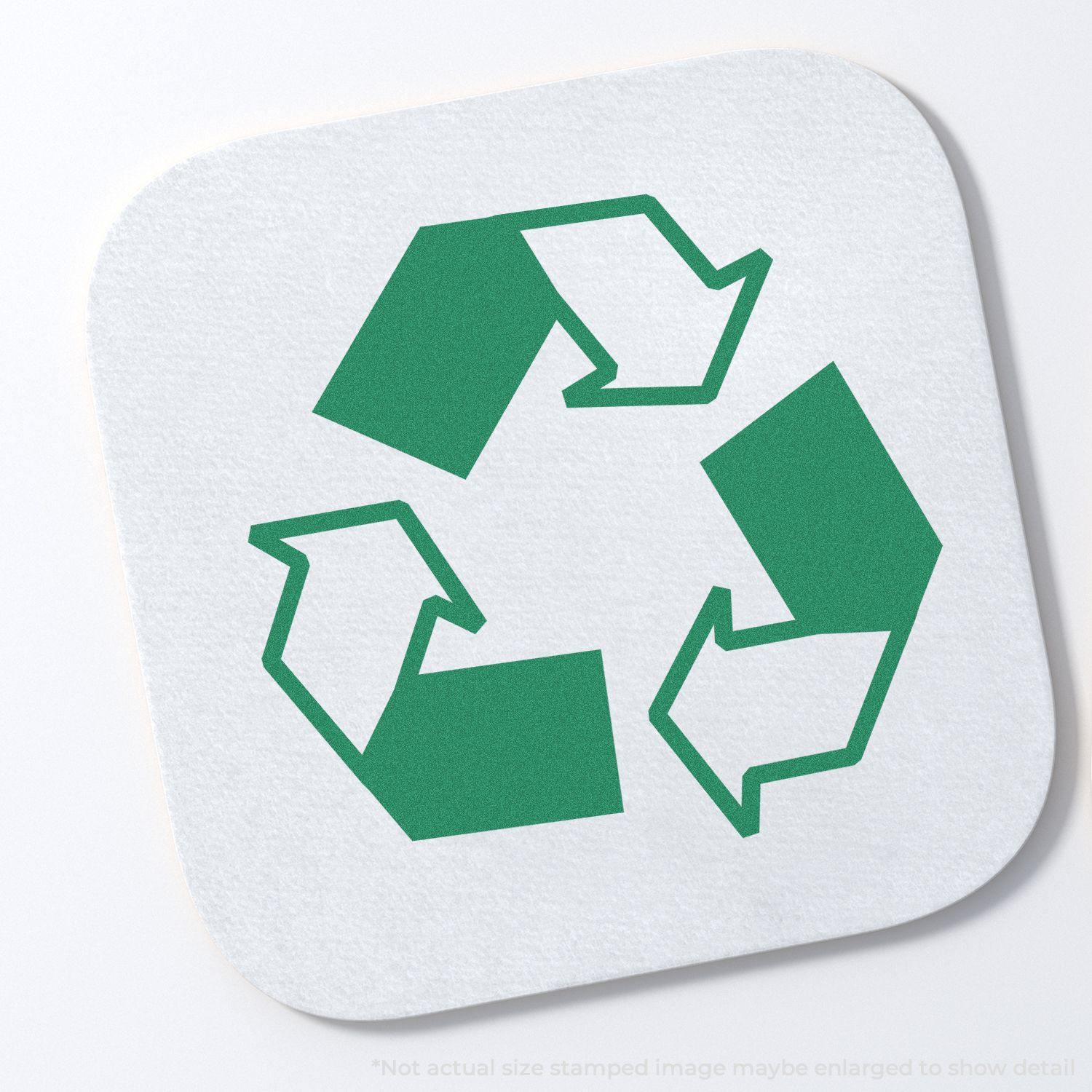 Round Recycle Logo Xstamper Stamp imprint showing a green recycling symbol with three arrows forming a triangle on a white background.