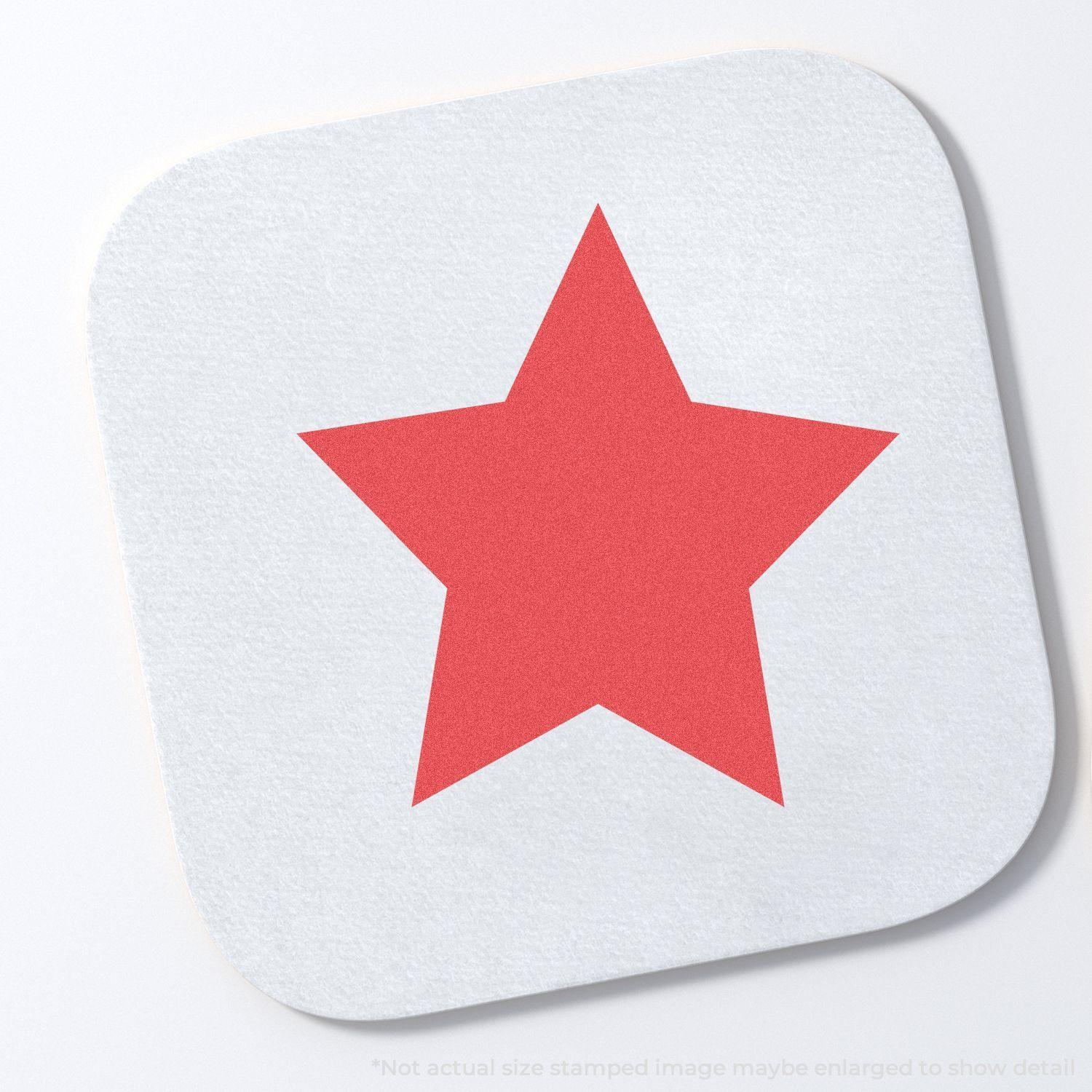 Round Red Star Xstamper Stamp imprint on a white square surface, displaying a bold red star in the center.
