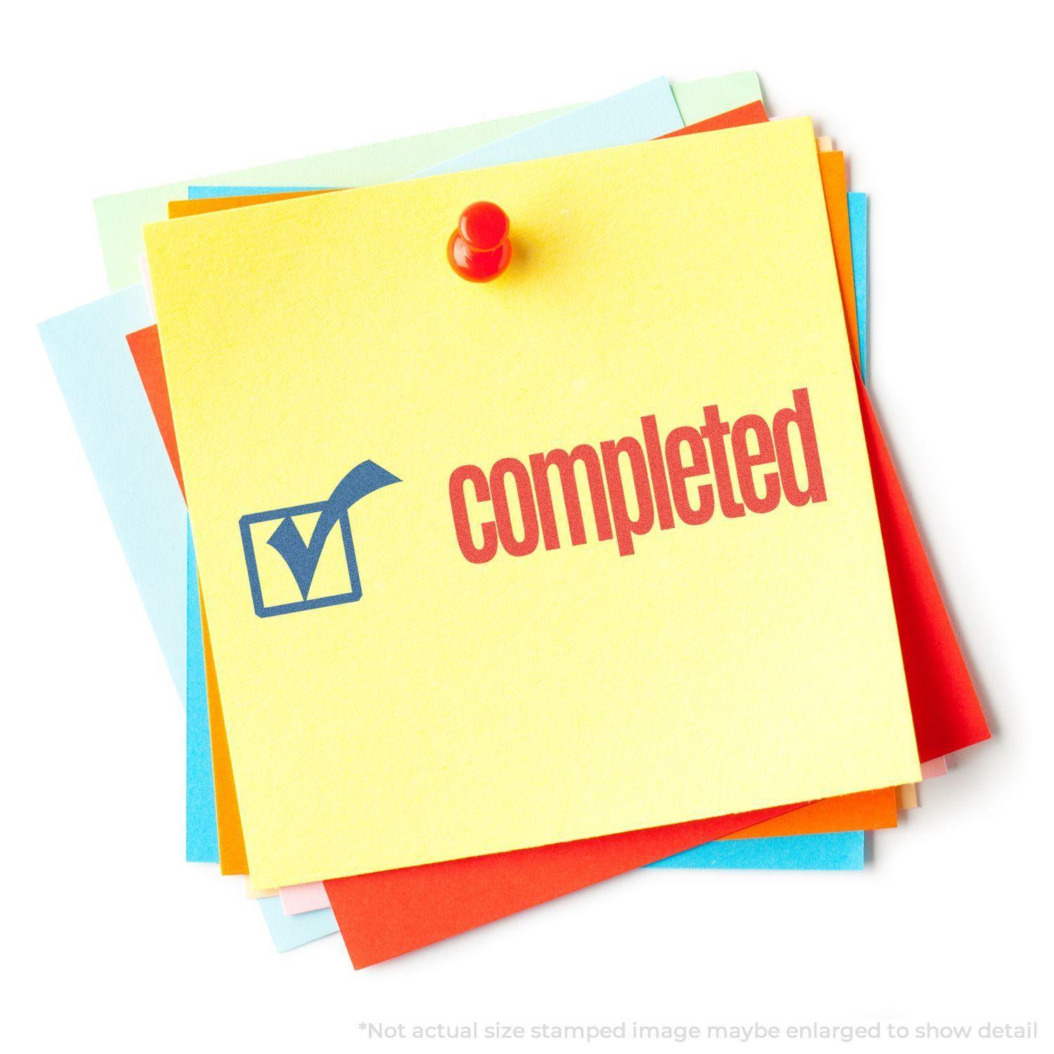 A stack of colorful sticky notes with a red pushpin, featuring a Two-Color Completed Xstamper Stamp showing a blue checkmark and red completed text.