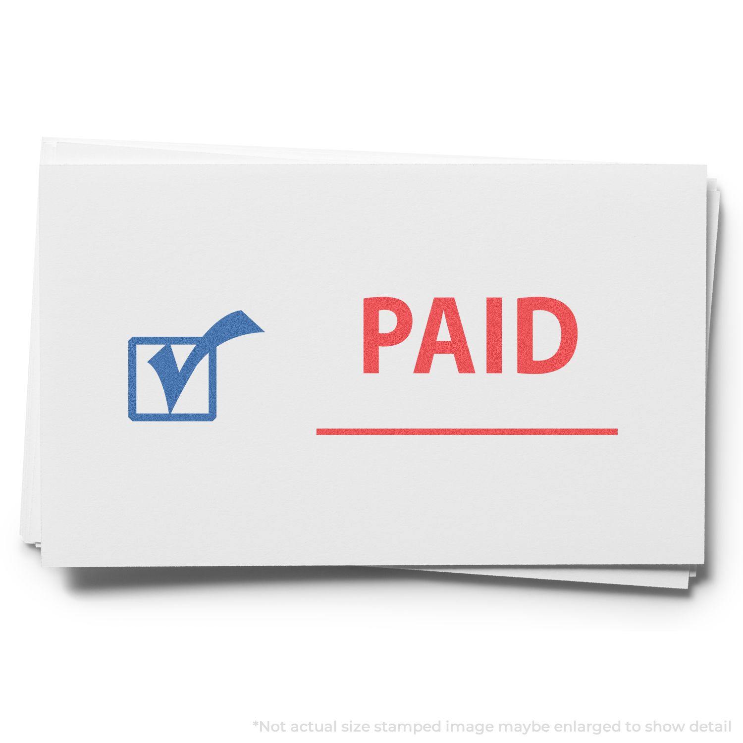 A stack of white cards stamped with a Two-Color Paid Xstamper Stamp, featuring a blue checkmark and red PAID text.