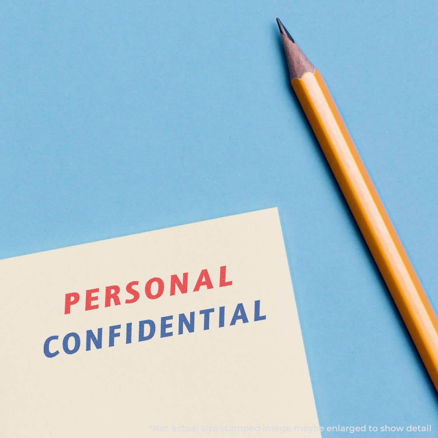 Two-Color Personal Confidential Xstamper Stamp in use, showing PERSONAL in red and CONFIDENTIAL in blue on paper, next to a pencil.