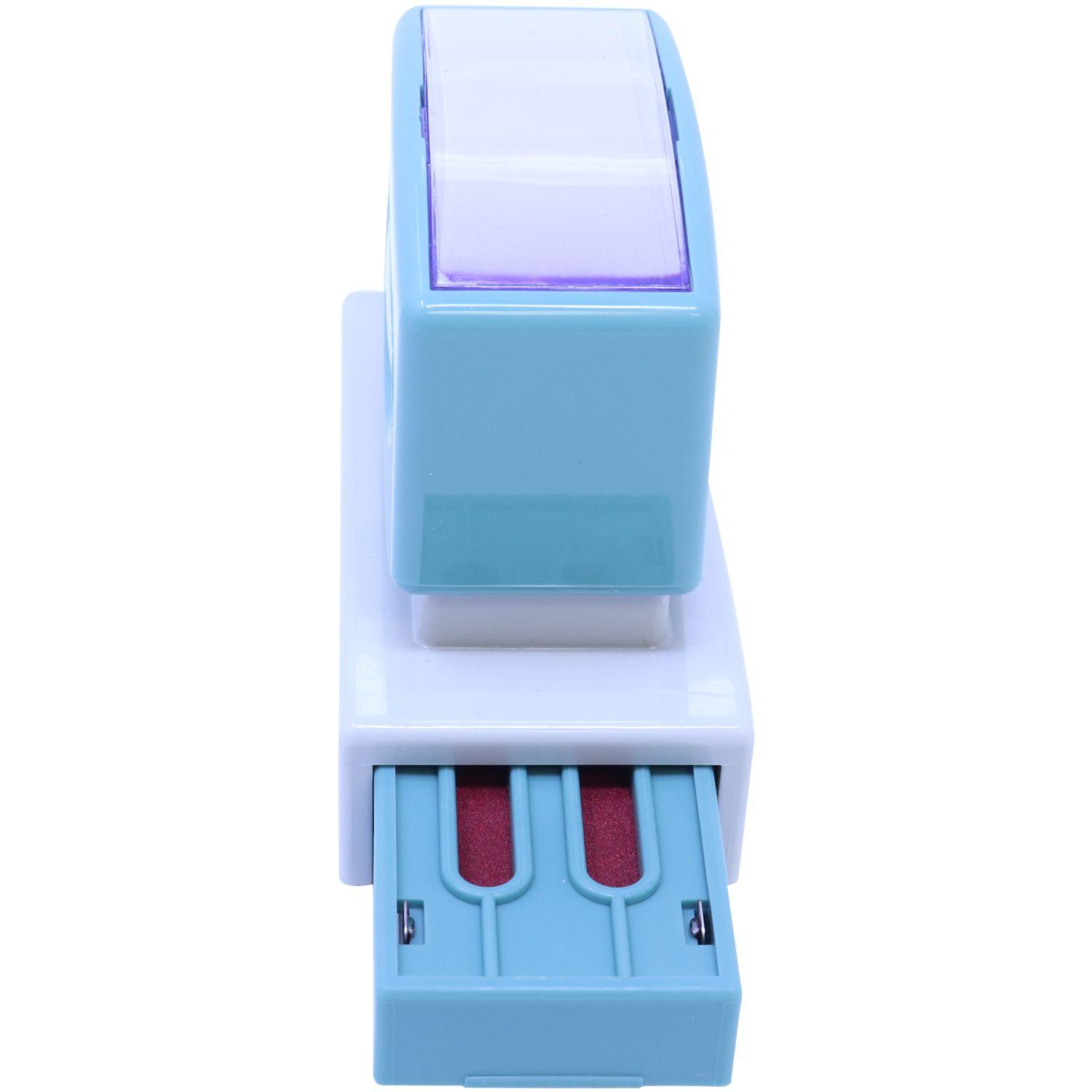 Jumbo Red Copy Xstamper Stamp with a blue and white body, showing the reinking side view with red ink pads visible.