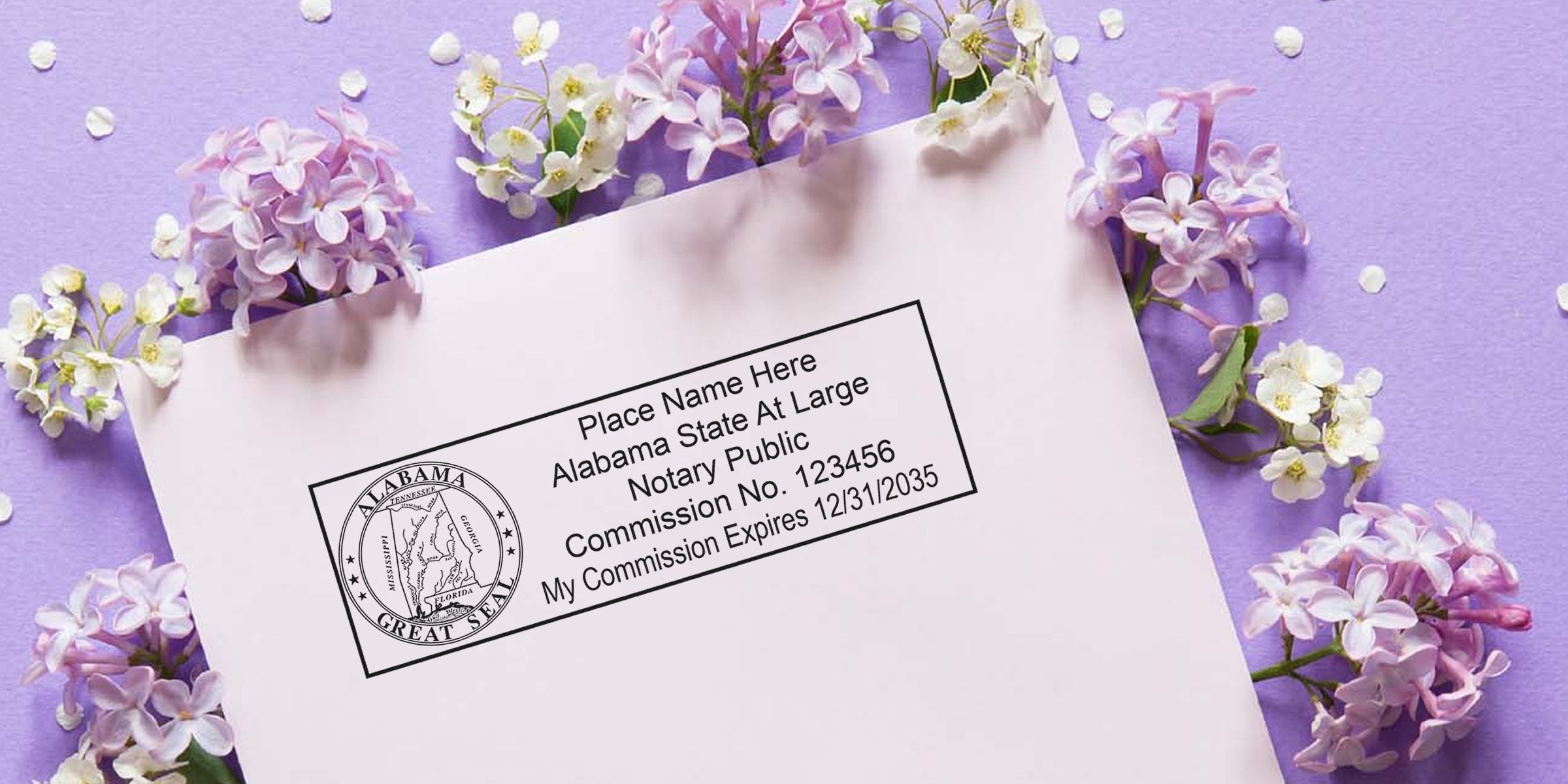 Envelope with Alabama notary public stamp and Great Seal printed on pastel pink paper, surrounded by lilac and white spring flowers on a purple background