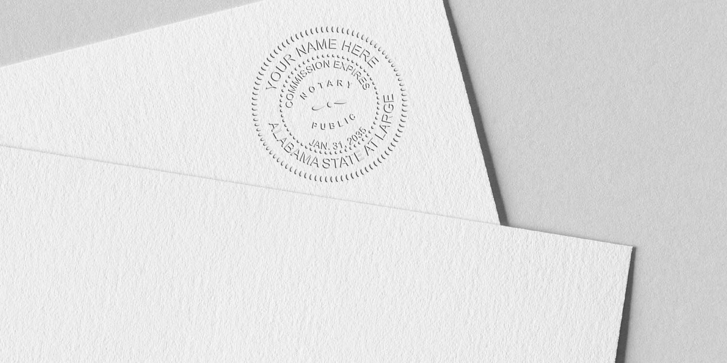 Embossed notary seal reading "Alabama State at Large" on white textured stationery and envelope corner, close-up of circular notary public stamp impression suitable for legal document or stationery mockup