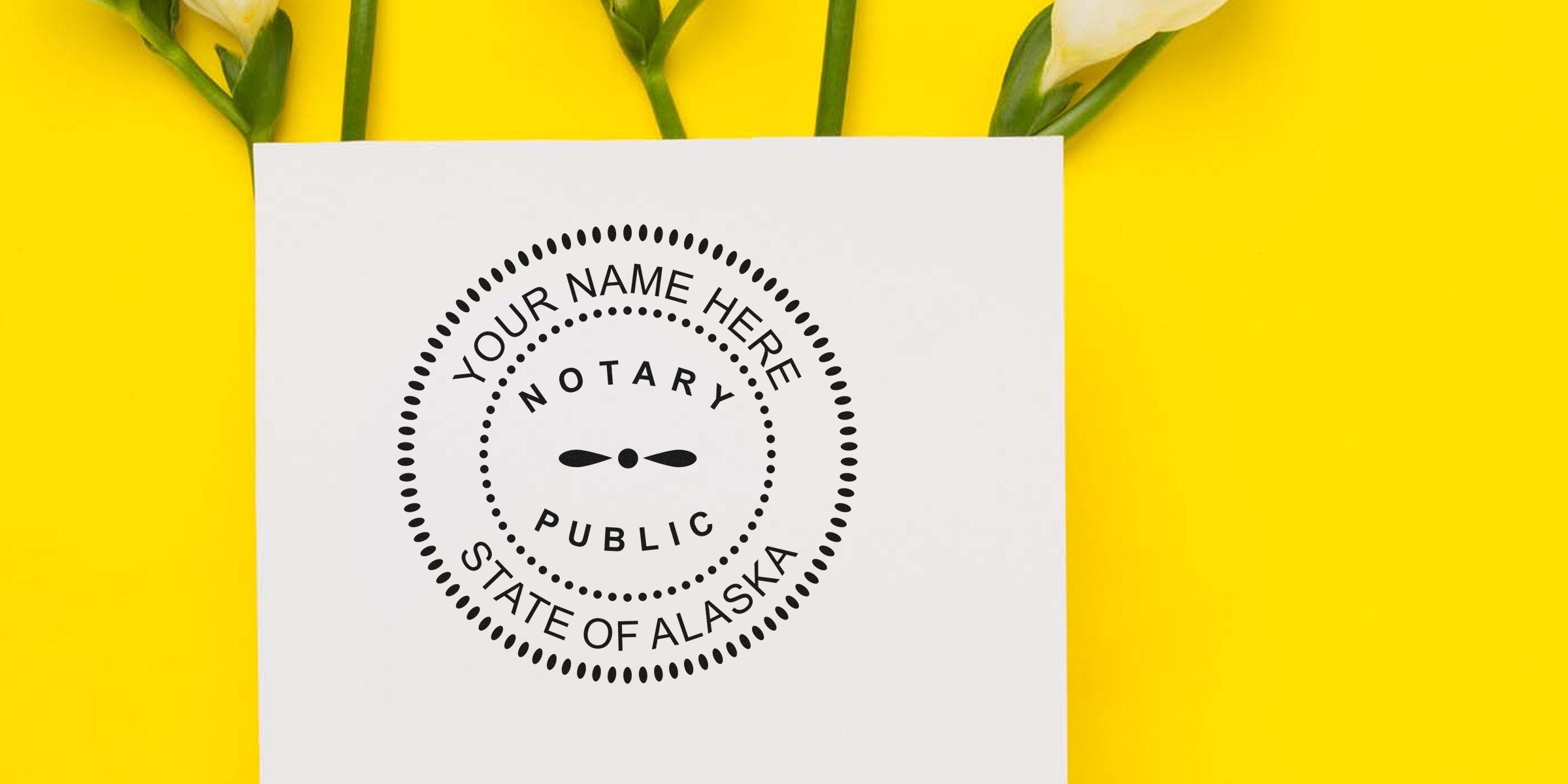 Notary public seal mockup on white card reading "Your Name Here, Notary Public, State of Alaska" placed on bright yellow background with white flowers — stationery branding image for Alaskan notaries.