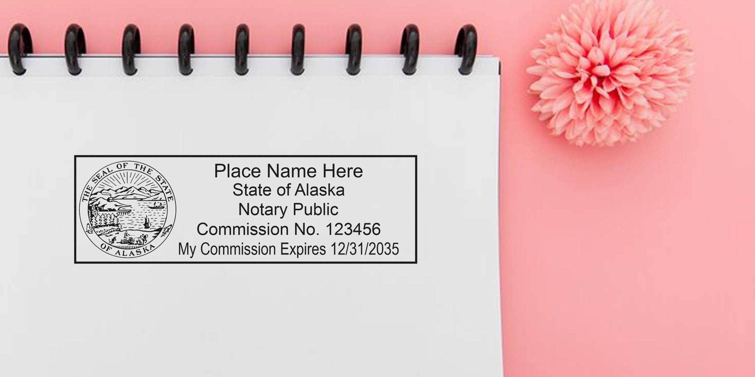 Alaska notary public stamp imprint on a white spiral notebook showing state seal, commission number and expiration date, styled on a pink background with a pink chrysanthemum — notary stamp mockup for document services
