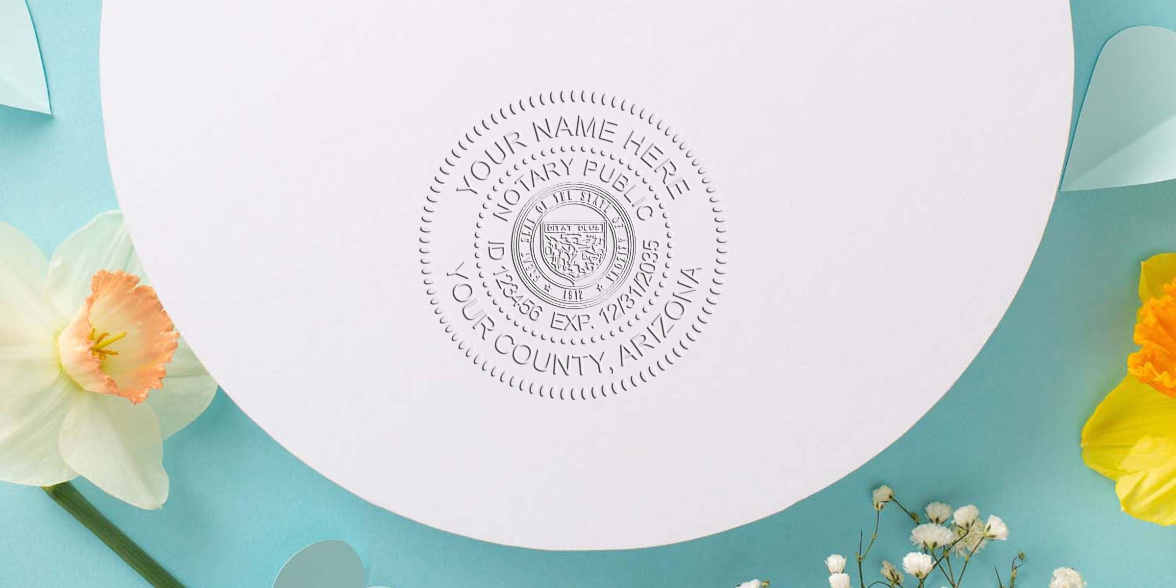 Embossed notary public seal on white circular paper with decorative floral accents on a turquoise background — close-up of custom notary stamp impression for certificates, documents, or official stationery.
