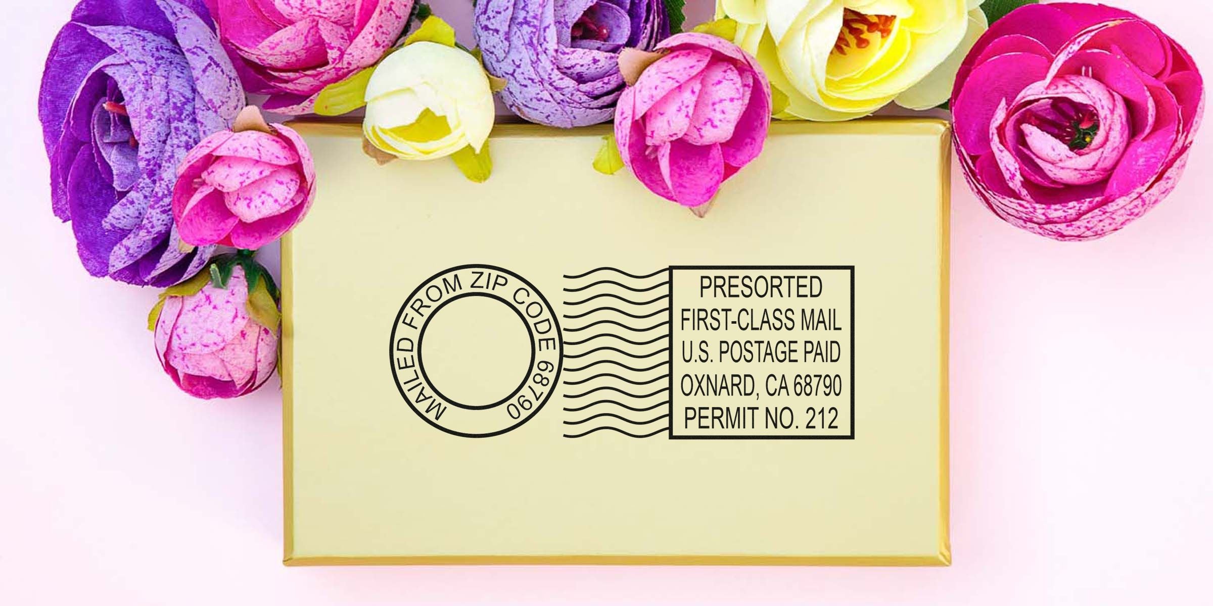 A beige gift box with a black postal stamp graphic sits on a pastel pink background, surrounded by bright pink, purple, and yellow flowers.