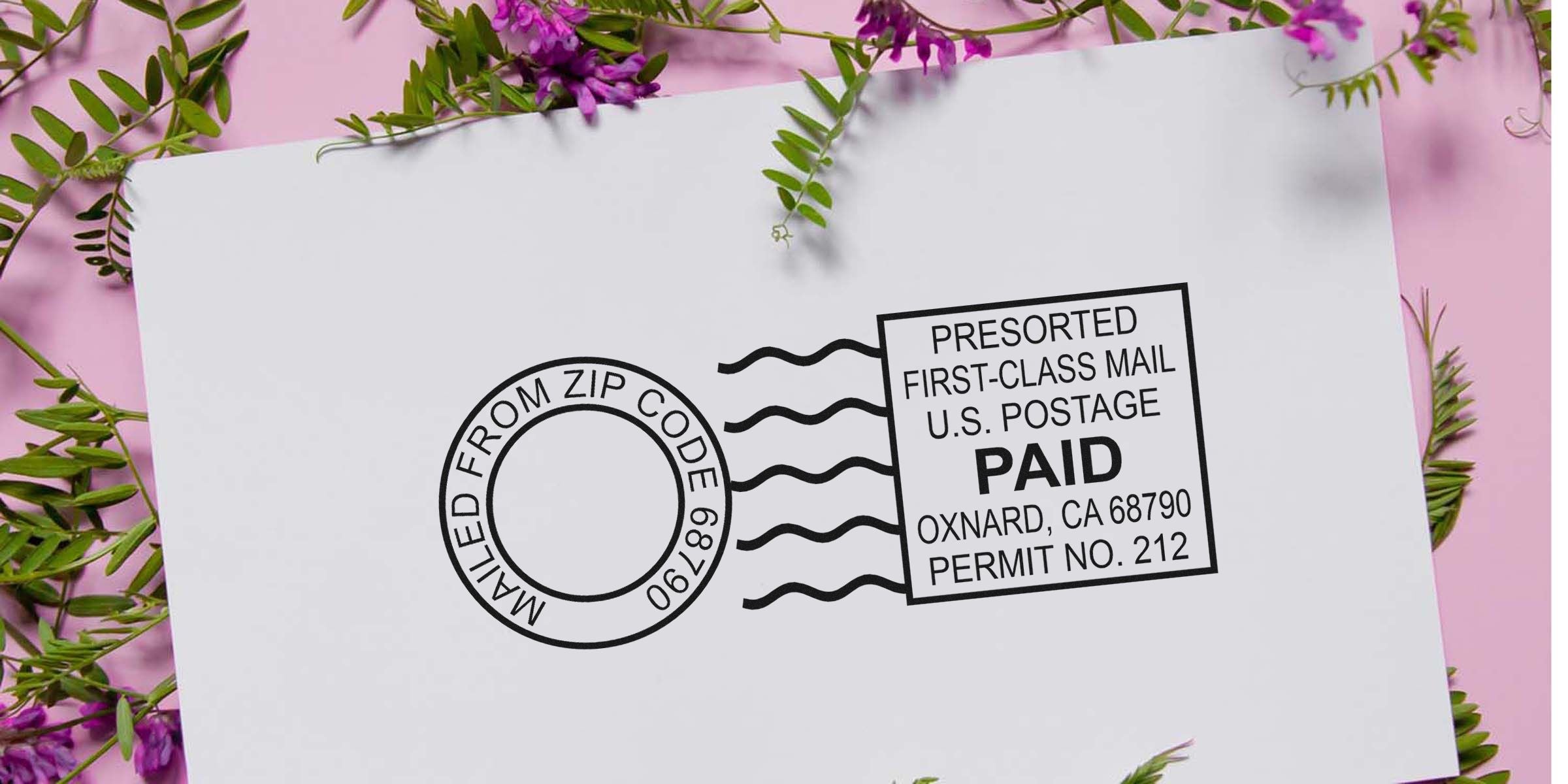 Postcard with a stamped "PAID" mark and a presorted first-class mail cancellation, on a pink background with green leaves.