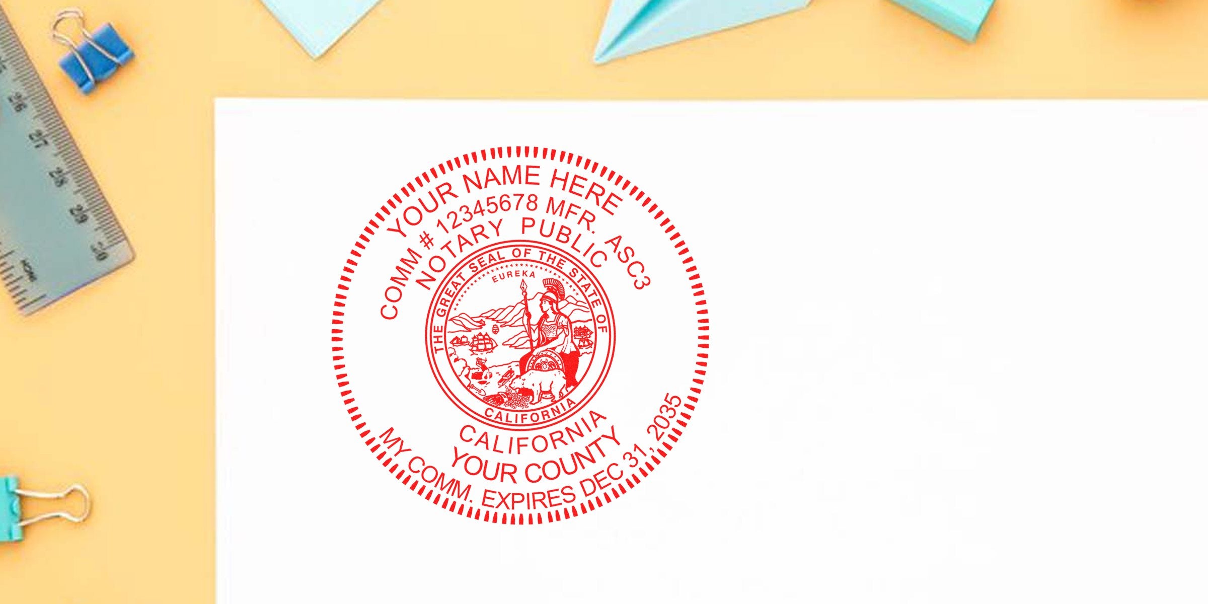 Red circular California notary stamp seal in red ink on white paper, detailed state seal and placeholder text, photographed on a pastel yellow office desk with ruler, blue binder clips and paper airplane—notary stamp close-up for legal documents.