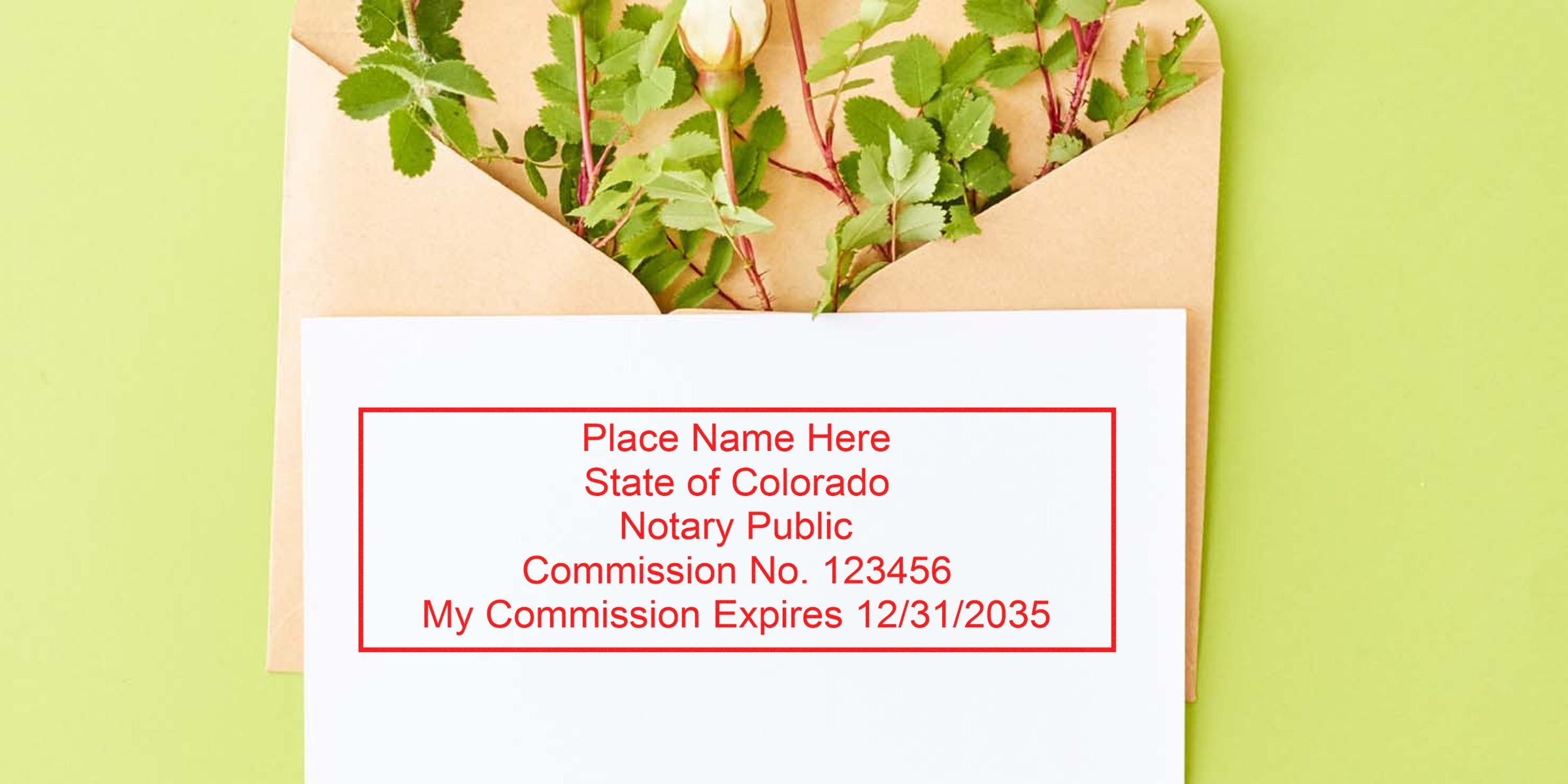 Brown kraft envelope with green rose stems and a cream rosebud peeking out; white card shows a red-framed sample notary stamp text (Place Name Here, State of Colorado, Notary Public, Commission No. 123456, commission expiry) on a light green background