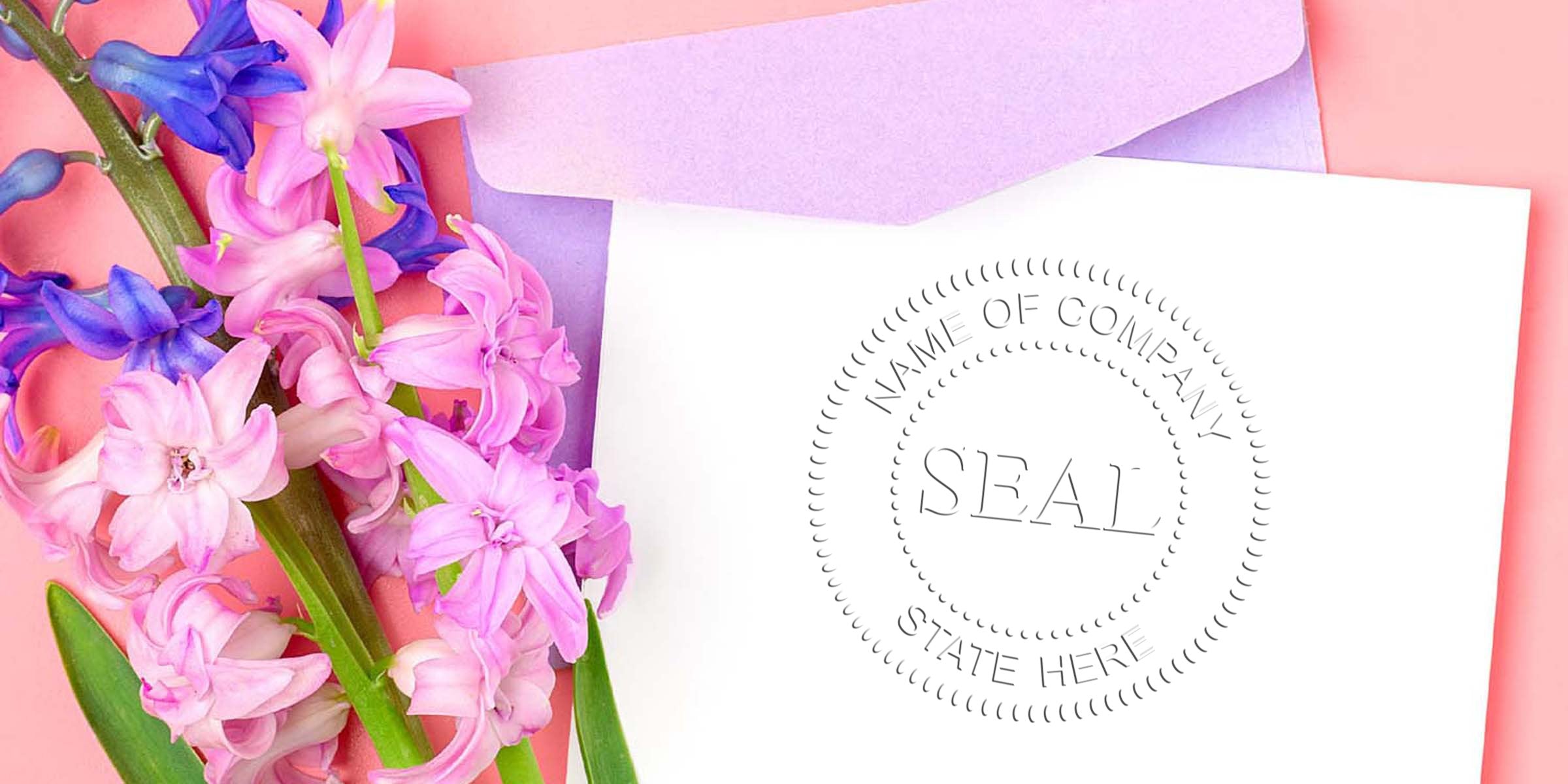 Close-up of pink and purple hyacinth bouquet beside a white card with a circular stamped seal reading “NAME OF COMPANY” and “SEAL.”