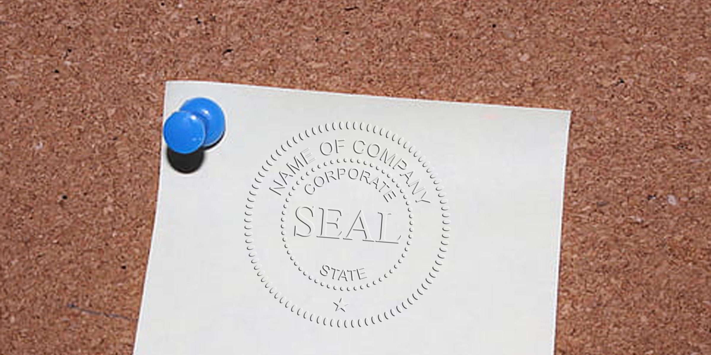 A sheet of paper with an embossed seal reading “SEAL” pinned to a corkboard with two blue push pins.