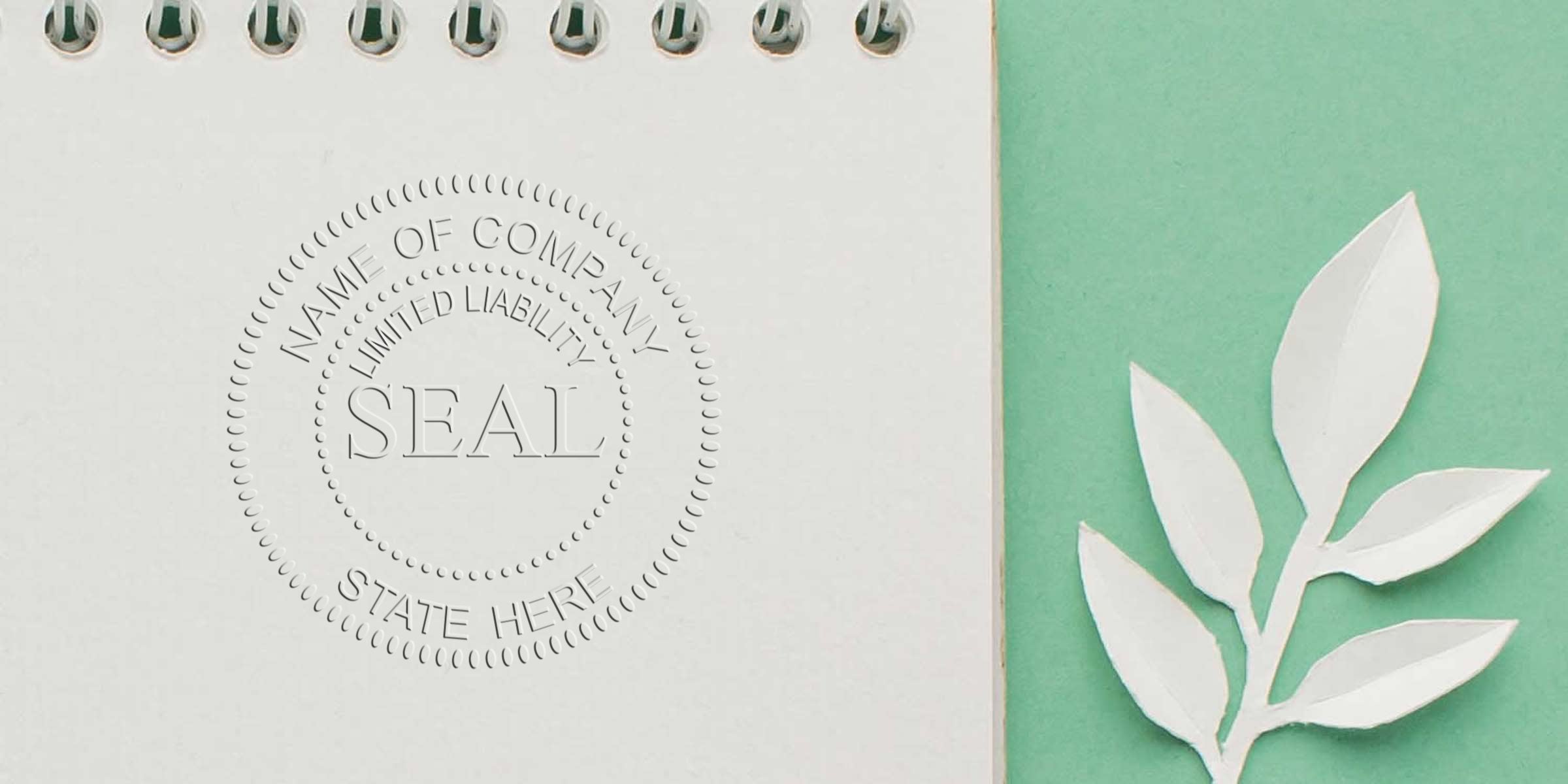 Circular embossed company seal with the word SEAL and placeholder text on a notebook page beside a green background with a white leaf cutout.