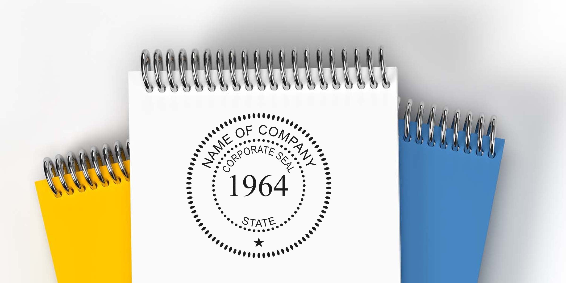 Spiral-bound notebook with a circular corporate seal reading the year 1964.