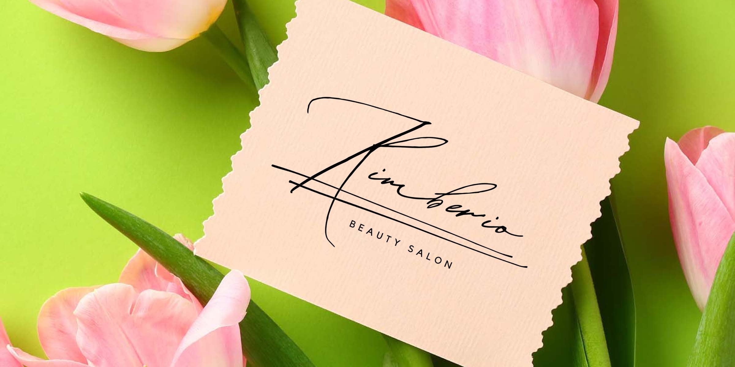 Elegant beauty salon logo "Zimberio" on torn blush paper card surrounded by pink tulips on bright green background — feminine branding mockup for spa, salon and floral aesthetic