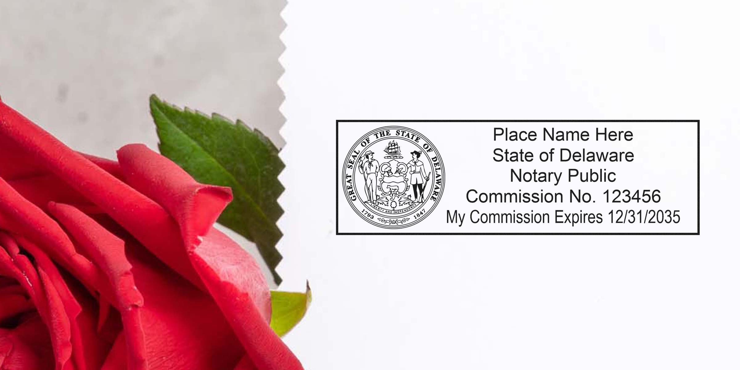 Close-up red rose with green leaf beside a printed Delaware notary public seal and sample commission stamp on white paper.