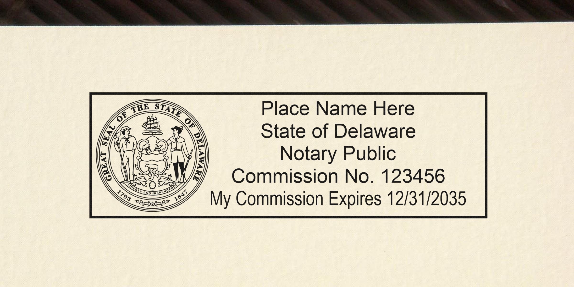 Rectangular Delaware notary public stamp with state seal on left, placeholder "Place Name Here" text, Commission No. 123456 and commission expiration date 12/31/2035 on the right