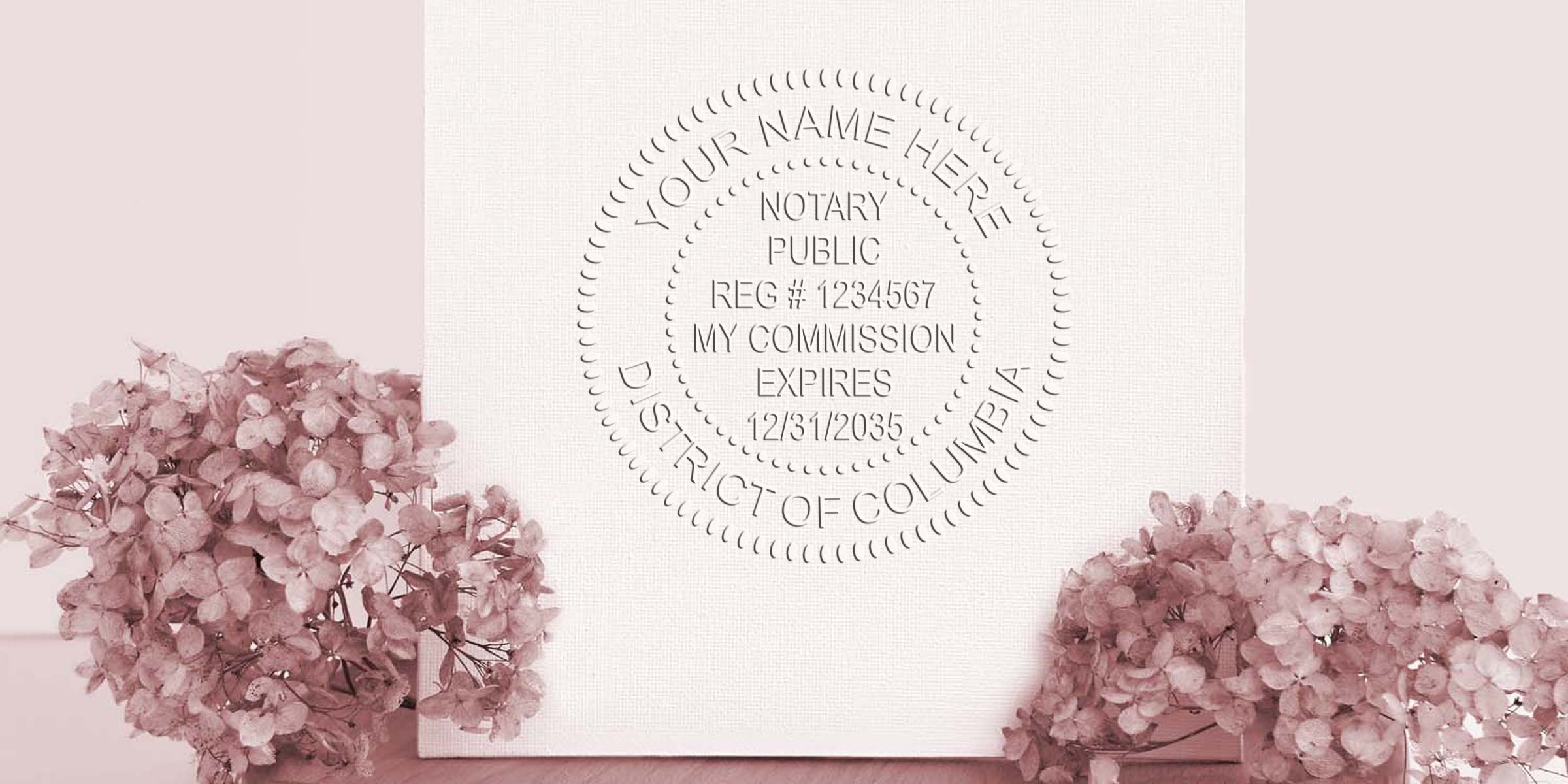 Embossed notary public seal mockup on white canvas reading Your Name Here, Notary Public, Reg #1234567, My Commission Expires 12/31/2035, District of Columbia, styled with soft pink hydrangea flowers at left and right