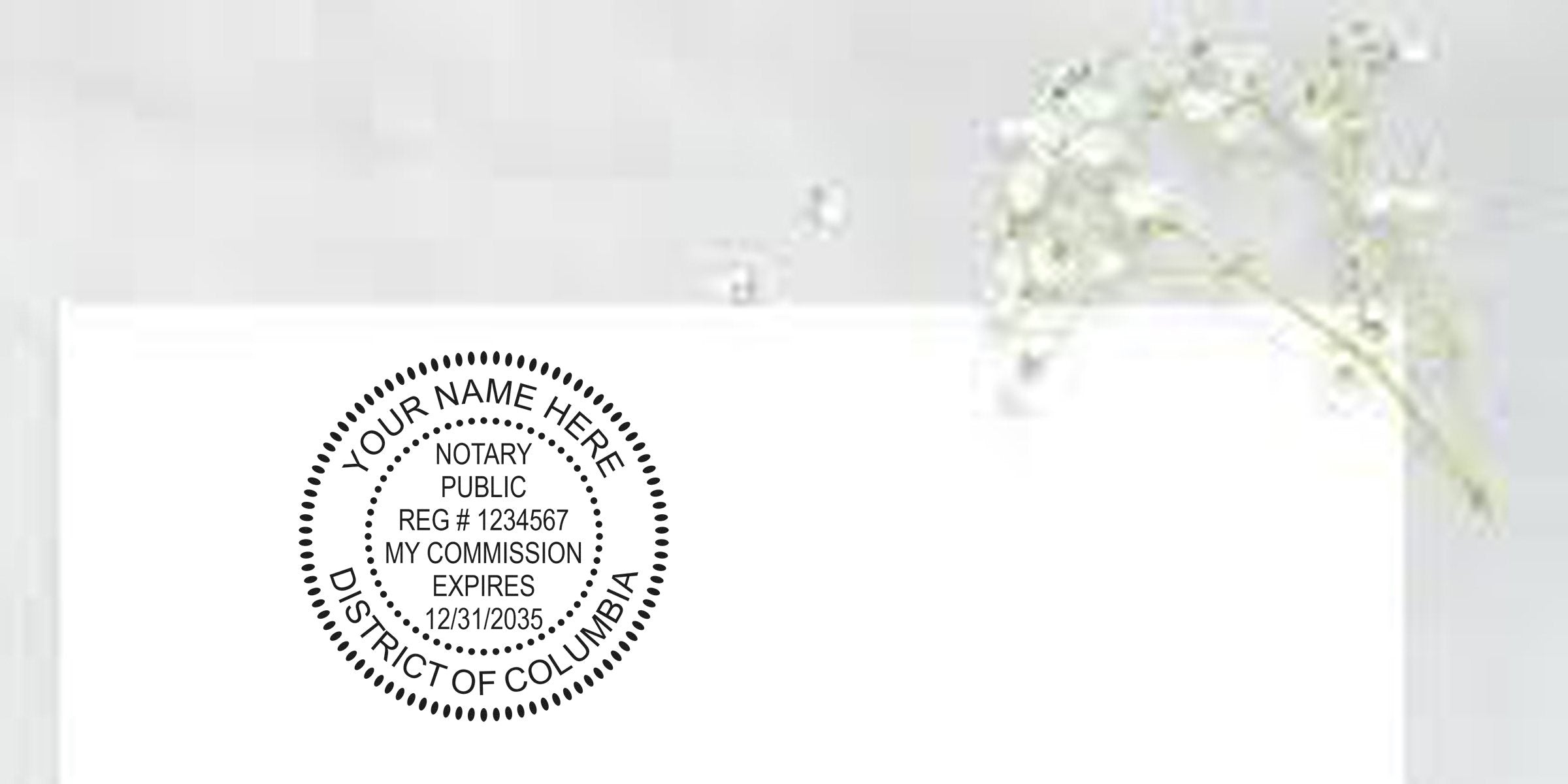 Notary public round seal stamp mockup reading Your Name Here Notary Public Reg #1234567 My Commission Expires 12/31/2035 District of Columbia on white paper with a delicate lily-of-the-valley sprig.