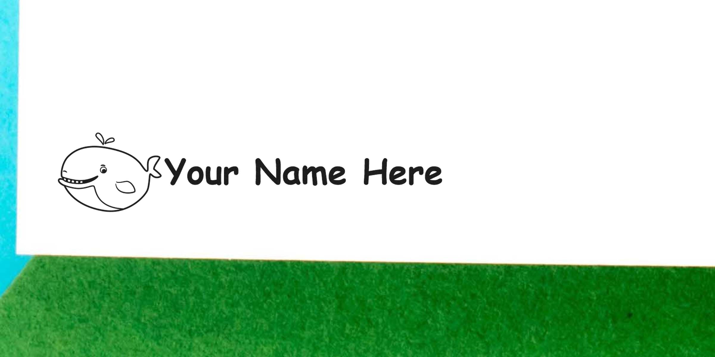 A simple line drawing of a smiling whale next to the text “Your Name Here” on a white background.