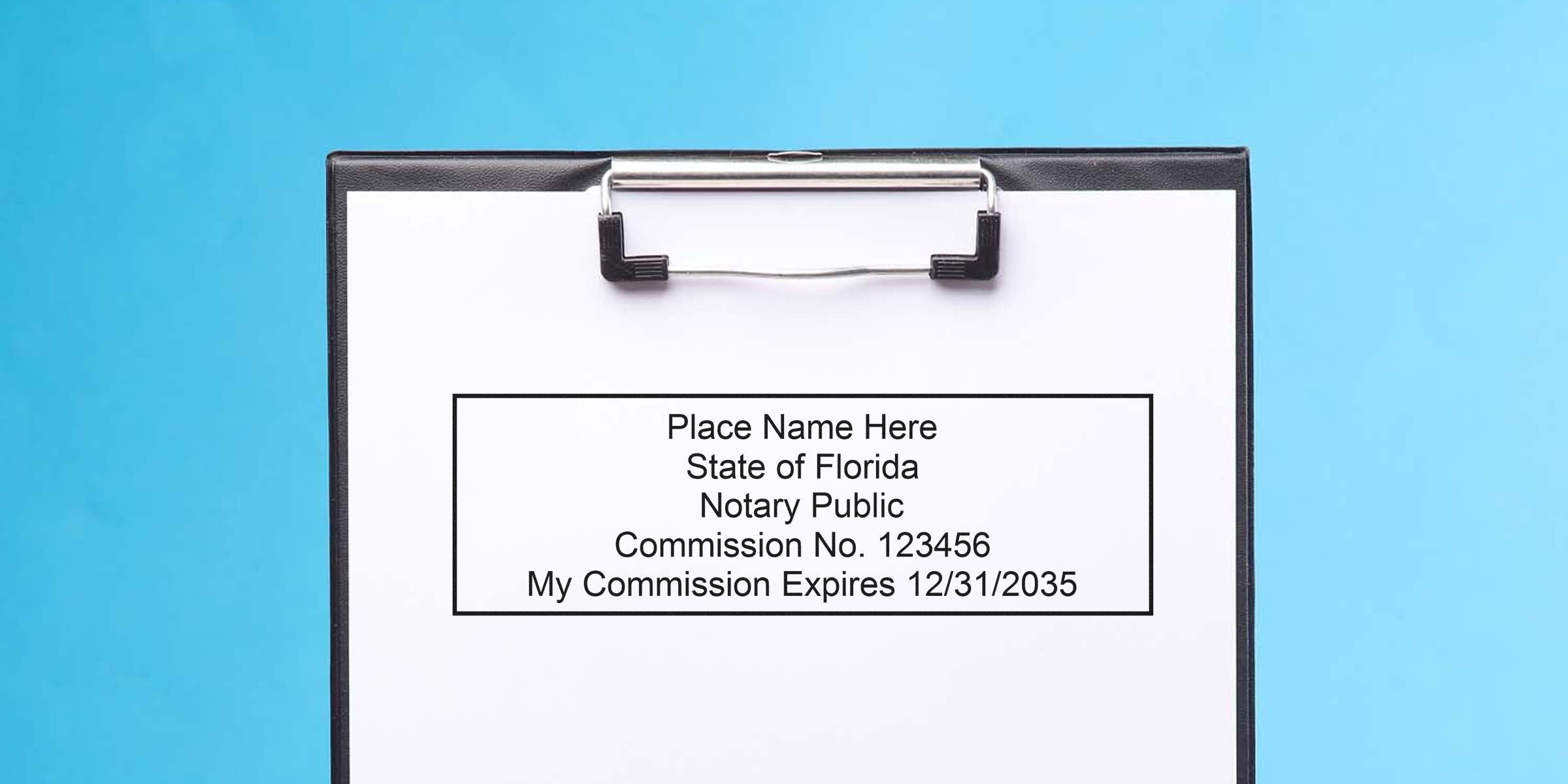 Clipboard with sample notary seal text reading "Place Name Here, State of Florida, Notary Public, Commission No. 123456, My Commission Expires 12/31/2035" on white paper against blue background