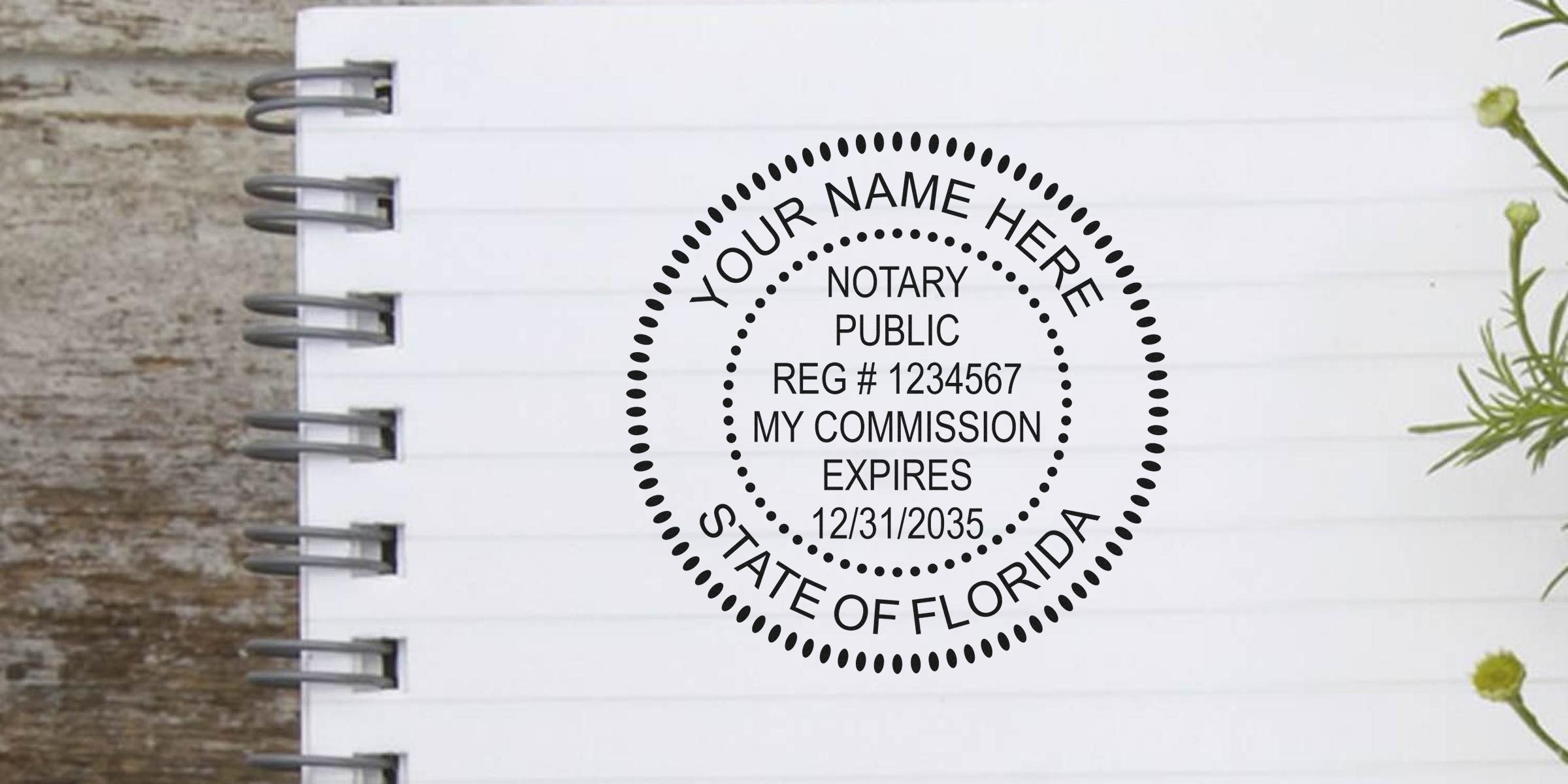 Round Florida notary public stamp mockup on spiral-lined notebook page featuring customizable name, reg. number and commission expiration date, decorative greenery accents
