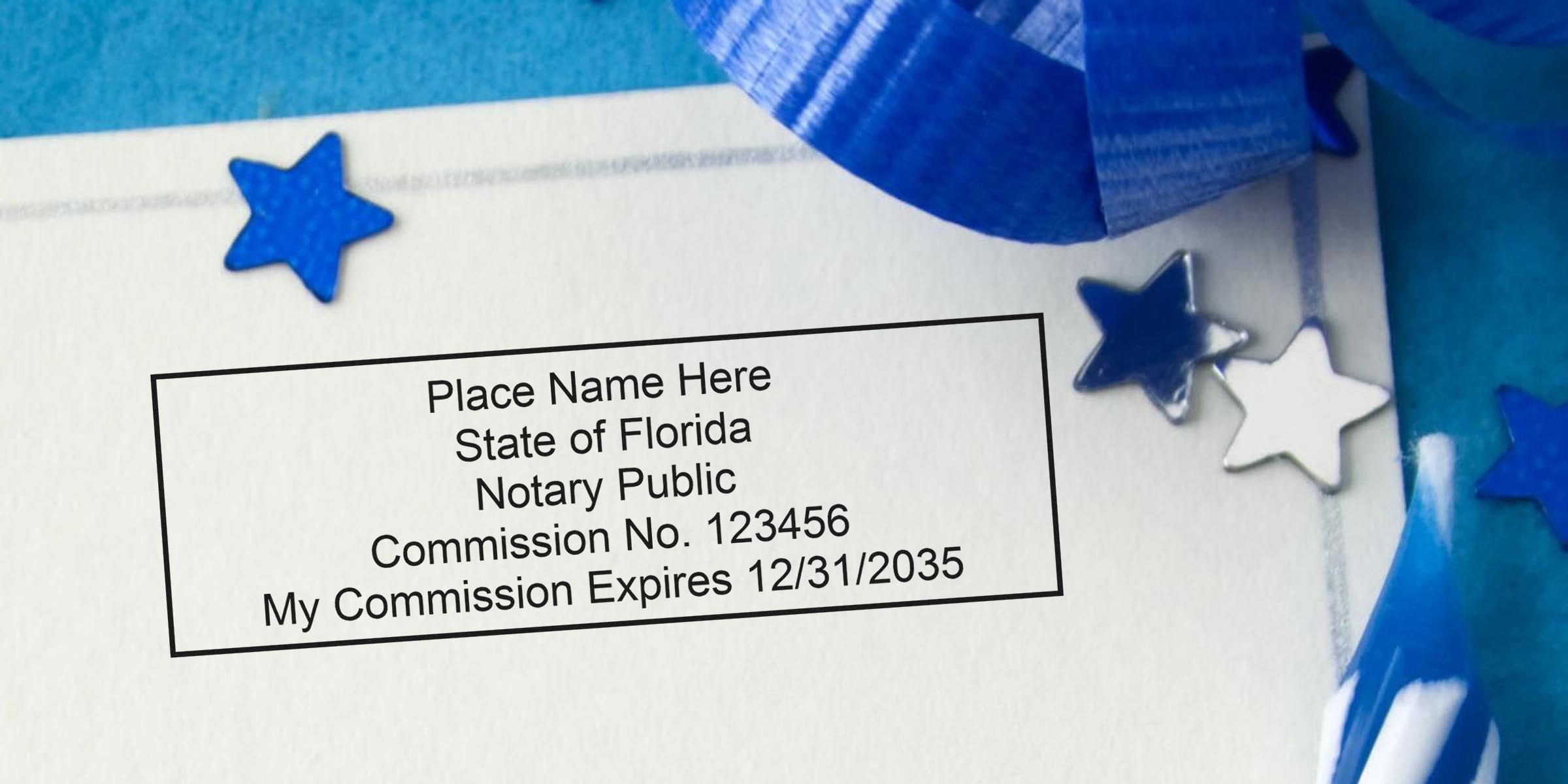 Close-up of a Florida notary public stamp mock-up on paper with commission number and expiration date, blue star confetti and ribbon decorations.