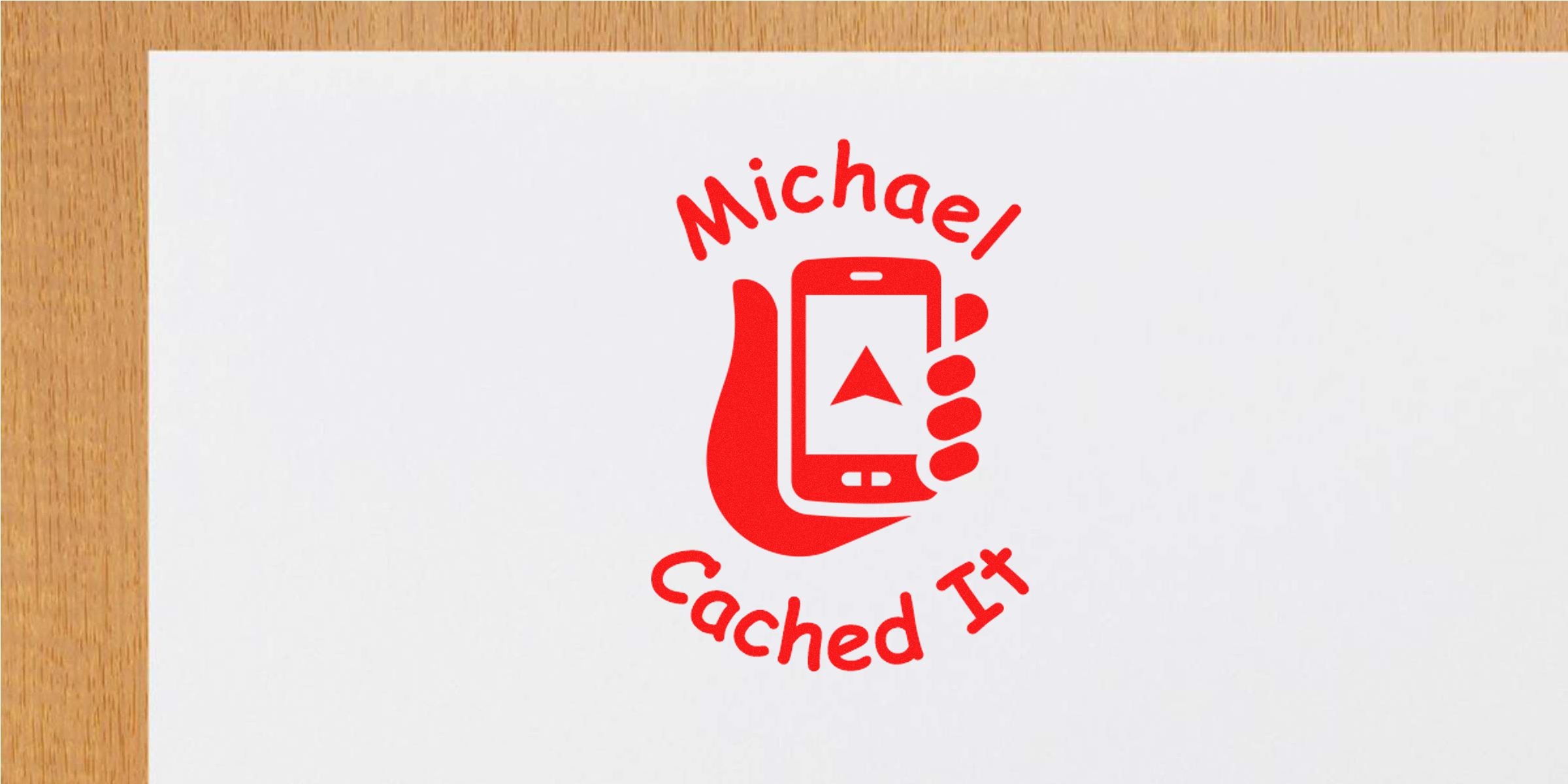 Graphic: a red hand holding a smartphone with a triangular icon on the screen, surrounded by the curved text “Michael” above and “Cached It” below.