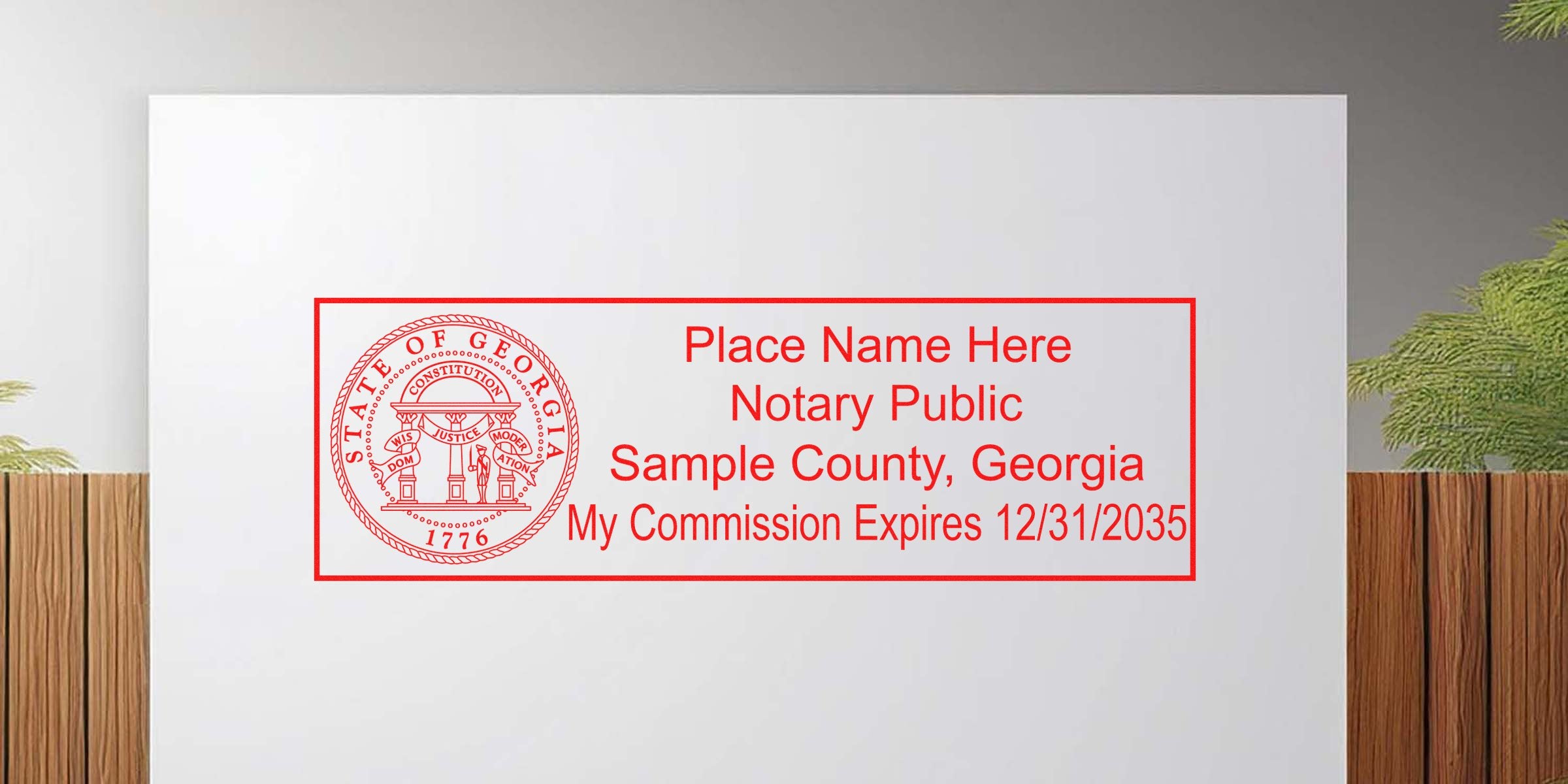Red Georgia notary public stamp mockup with state seal at left and placeholder text "Place Name Here, Notary Public, Sample County, Georgia, My Commission Expires 12/31/2035" inside a red rectangular border