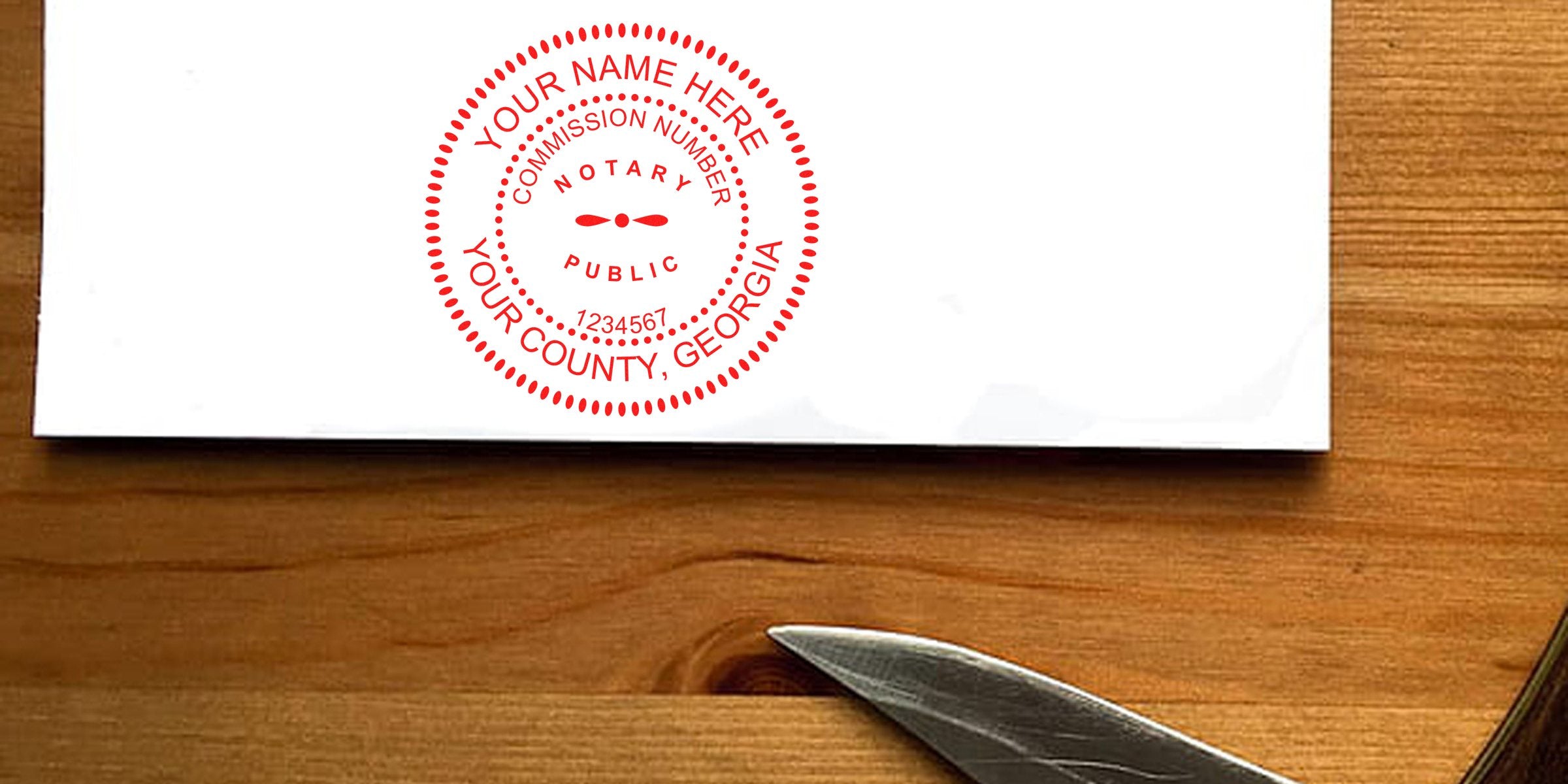 White envelope on wooden table with red circular notary public stamp reading "Your Name Here, Your County, Georgia" and silver scissors nearby