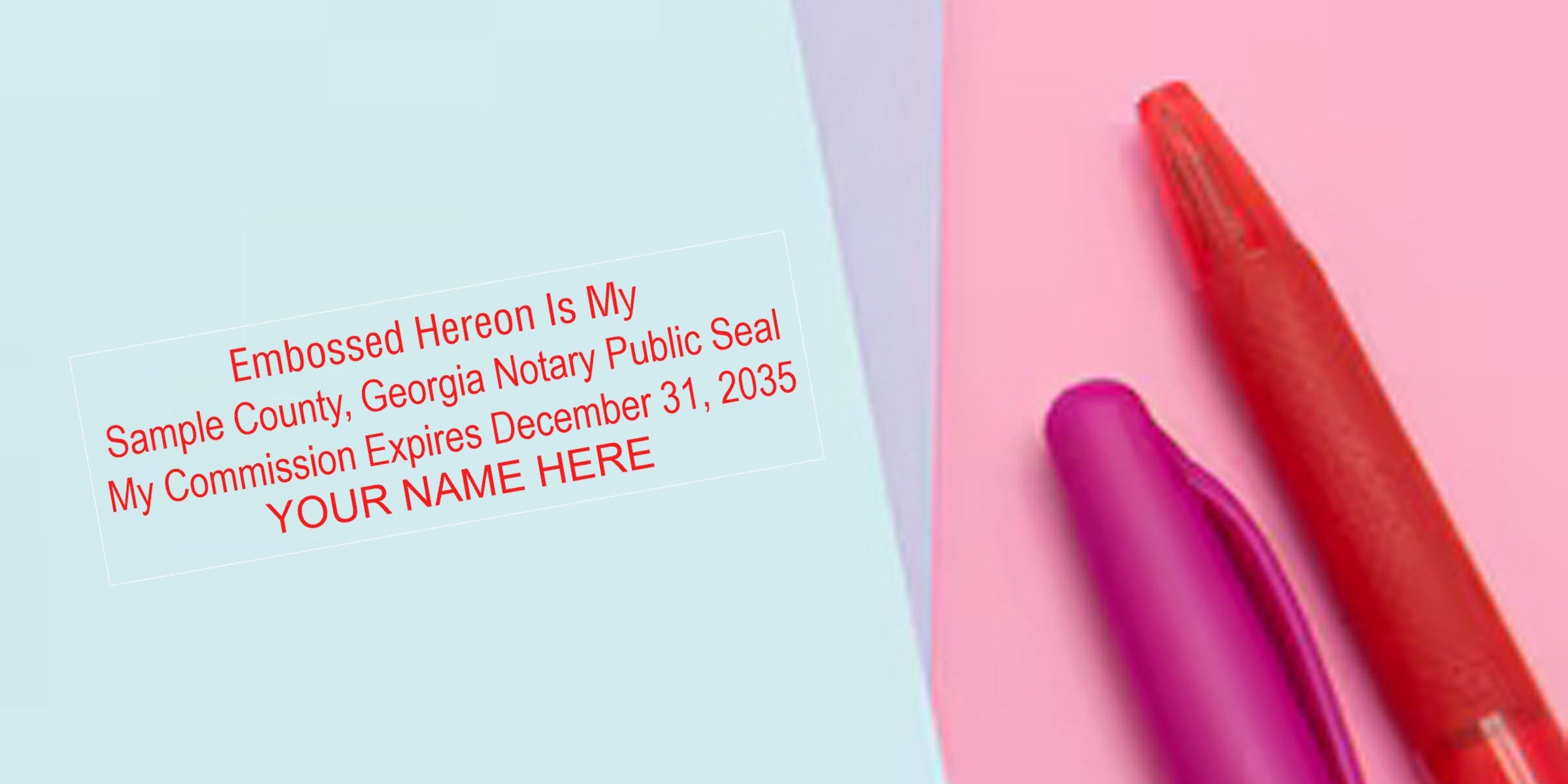 Close-up of a red "Embossed Hereon" sample Georgia notary public seal with commission expiration date on pastel blue/pink background beside purple and red pens