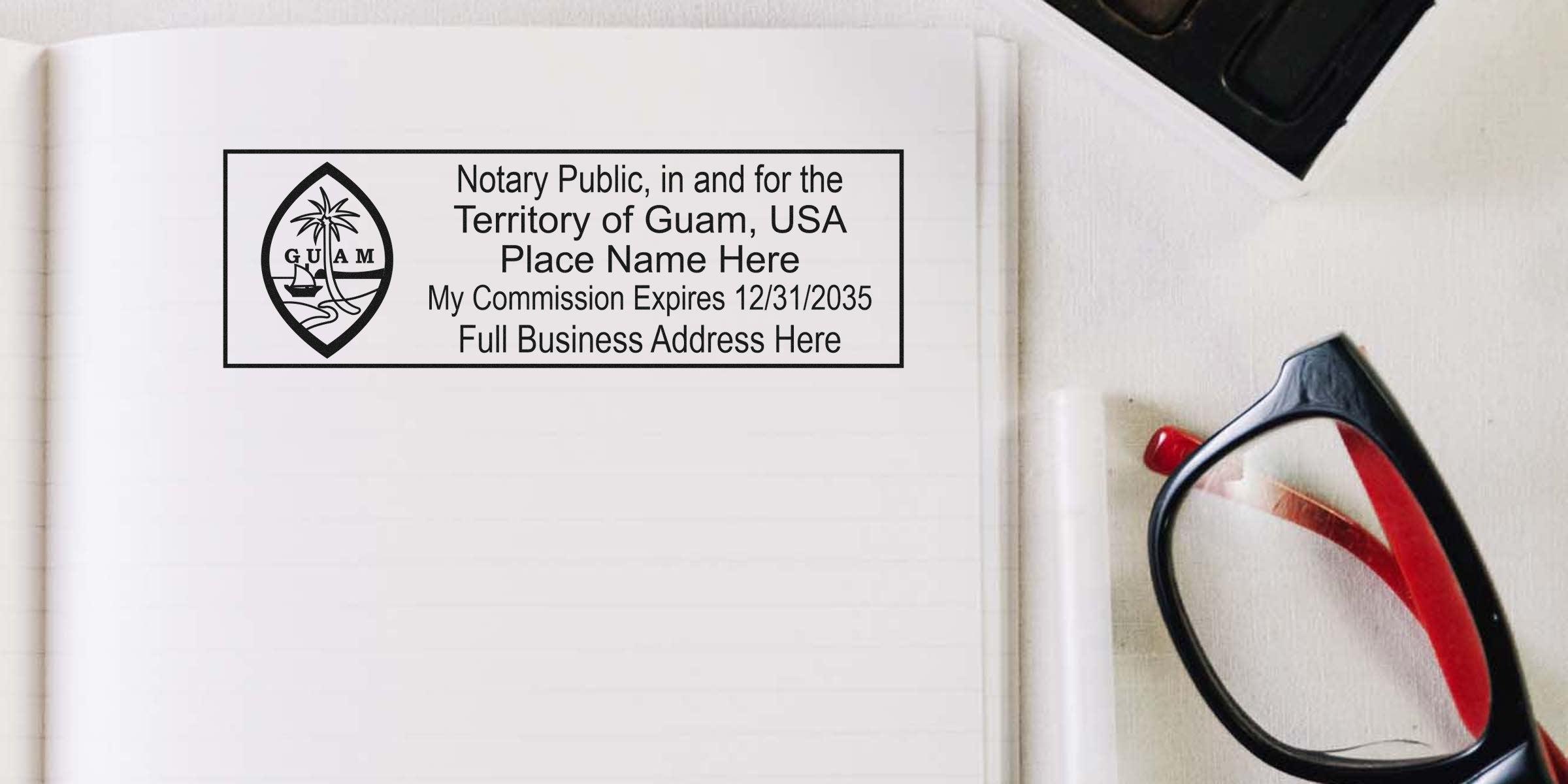 Close-up of a notary stamp imprint for the Territory of Guam, USA on a lined notebook page, with black/red eyeglasses beside it.