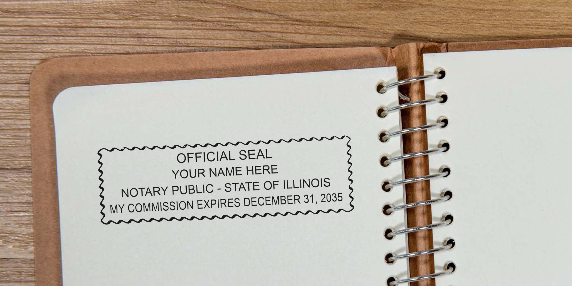 Notary public official seal stamp impression reading "OFFICIAL SEAL YOUR NAME HERE NOTARY PUBLIC - STATE OF ILLINOIS MY COMMISSION EXPIRES DECEMBER 31, 2035" on an open spiral-bound notebook page over a wooden table