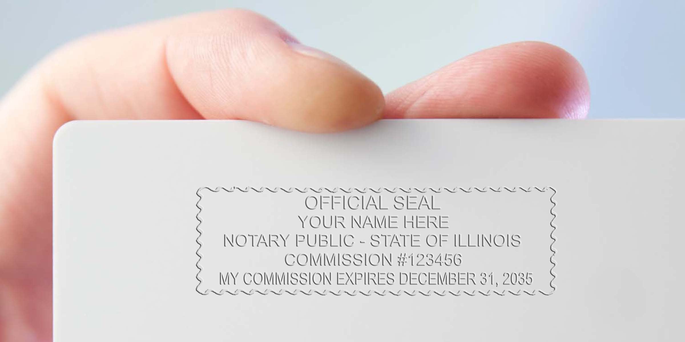 Close-up of a hand holding a white card embossed with an official notary public seal and placeholder commission details (State of Illinois, commission number, commission expiration date)