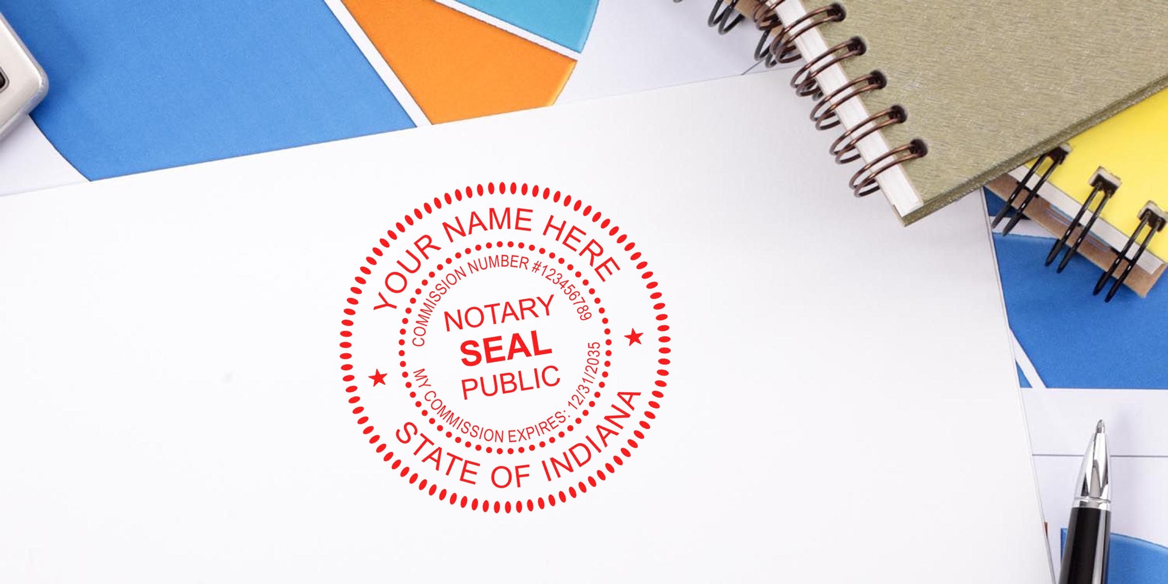 Red circular Indiana notary seal stamp on white document, “Notary Seal Public” text, surrounded by spiral notebooks, colorful paper and a pen — official notary public stamp image