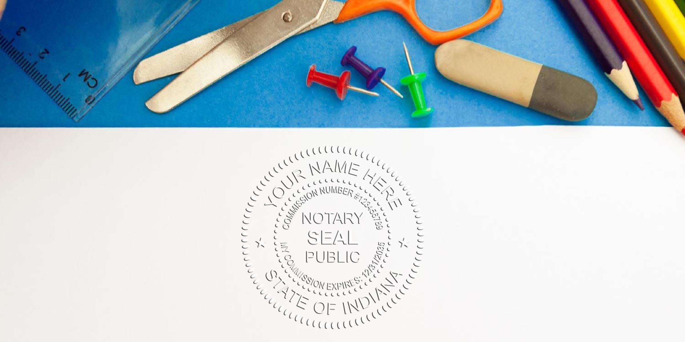 Top view of colorful school supplies (scissors, ruler, push pins, eraser, colored pencils) on blue background above a white sheet embossed with a circular Notary Public seal reading "State of Indiana."
