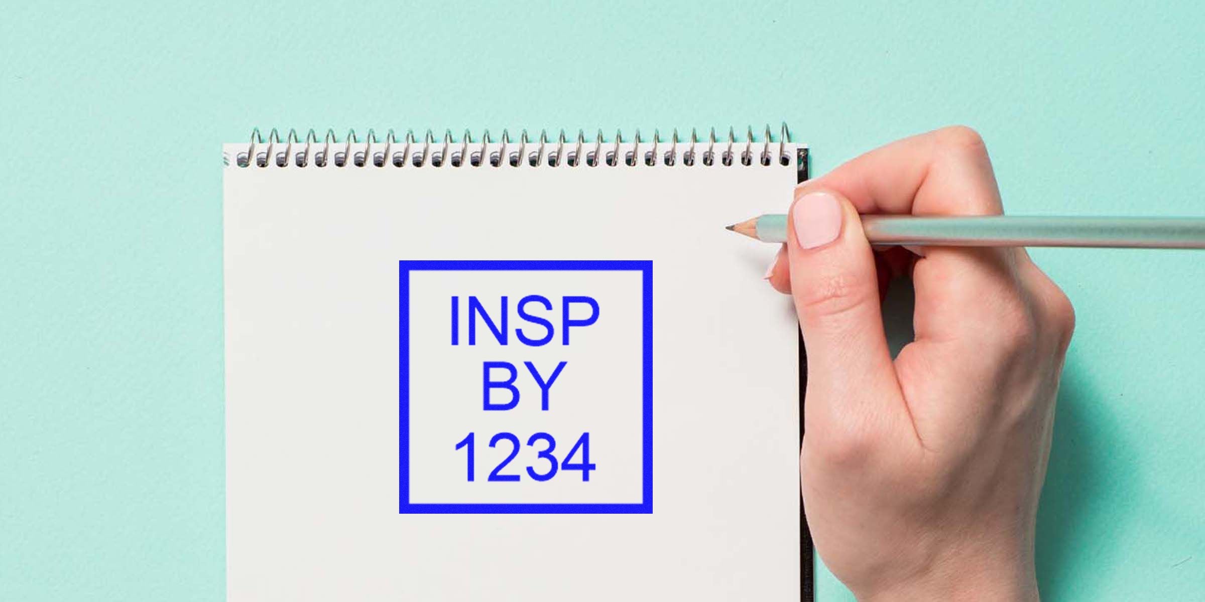 Notepad with a blue square border containing the text “INSP BY 1234.”
