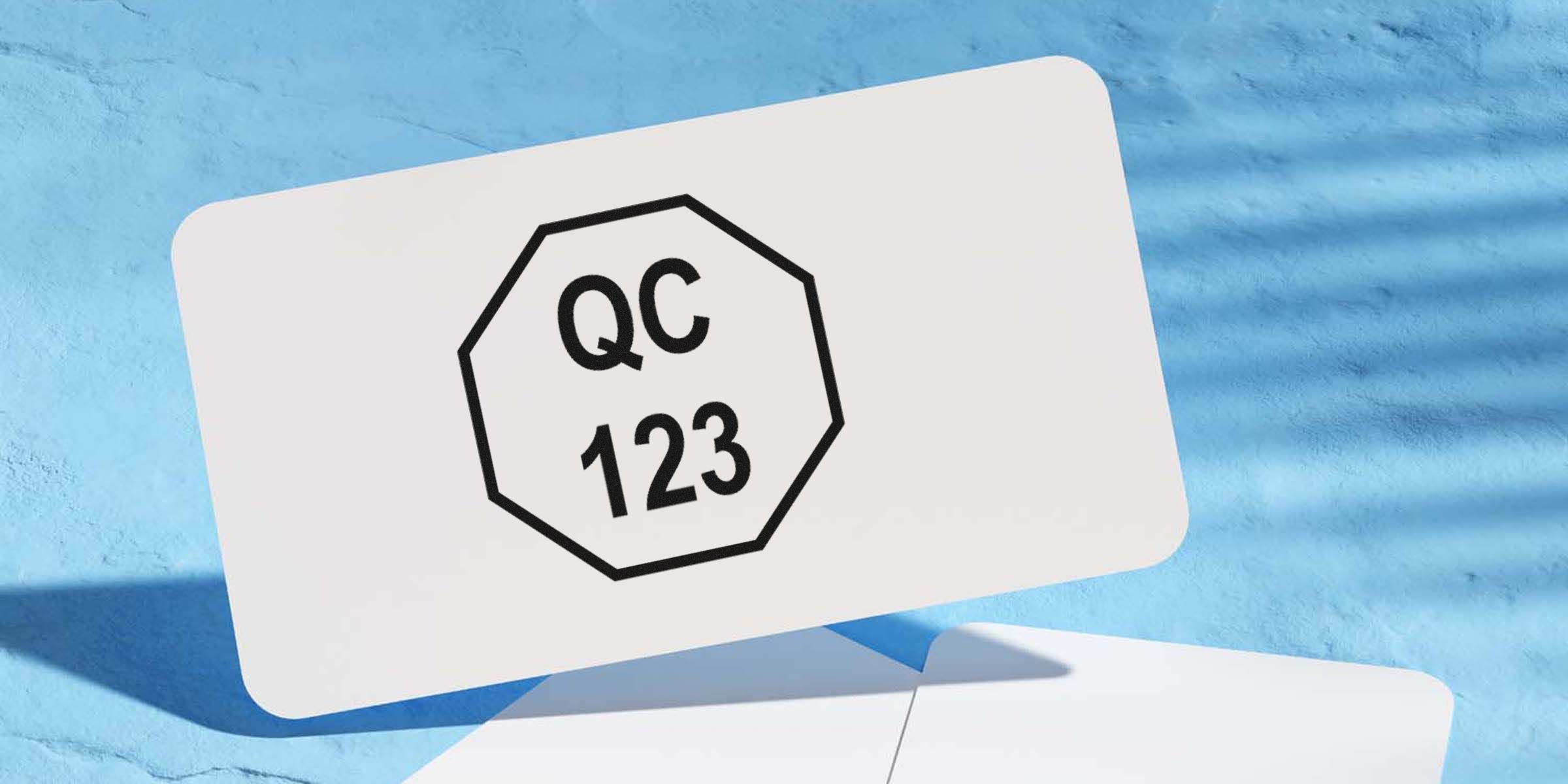 Icon of “QC 123” inside a black octagonal border on a white card floating over a blue pool background.