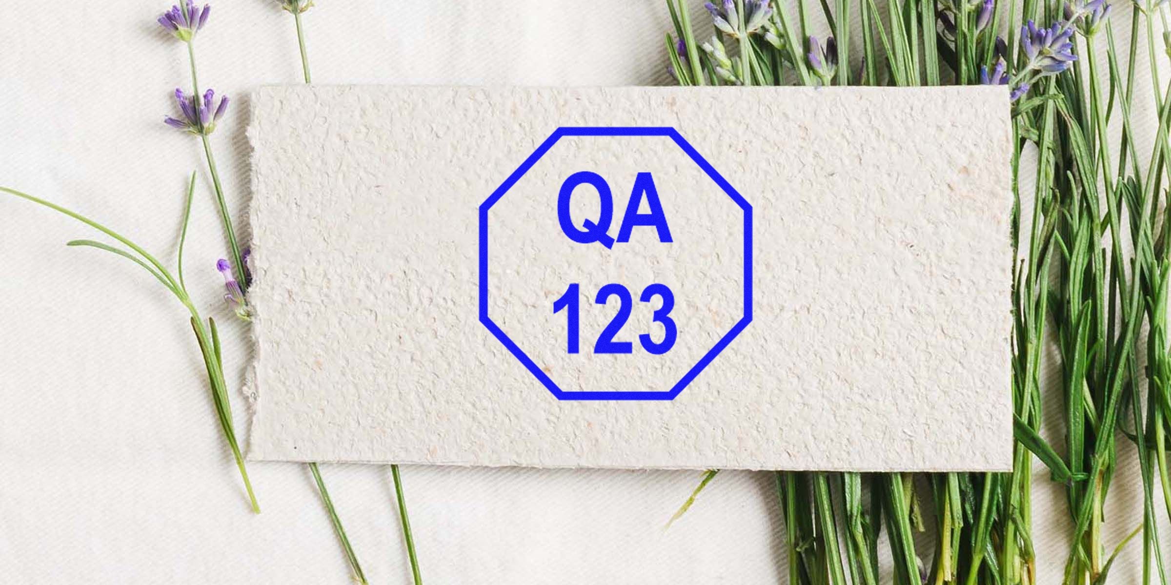 QA 123 badge on a textured stone card with lavender sprigs.