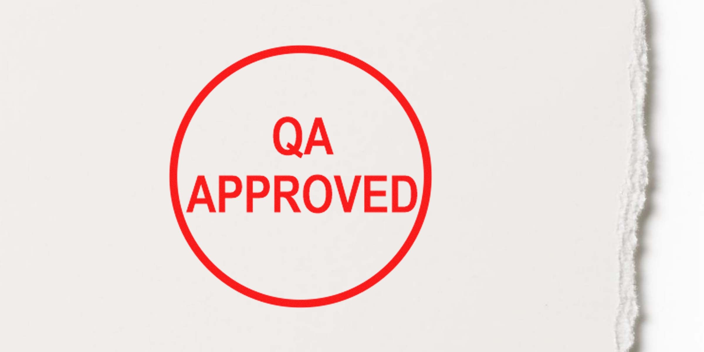 QA approved stamp in a red circle on a light background.