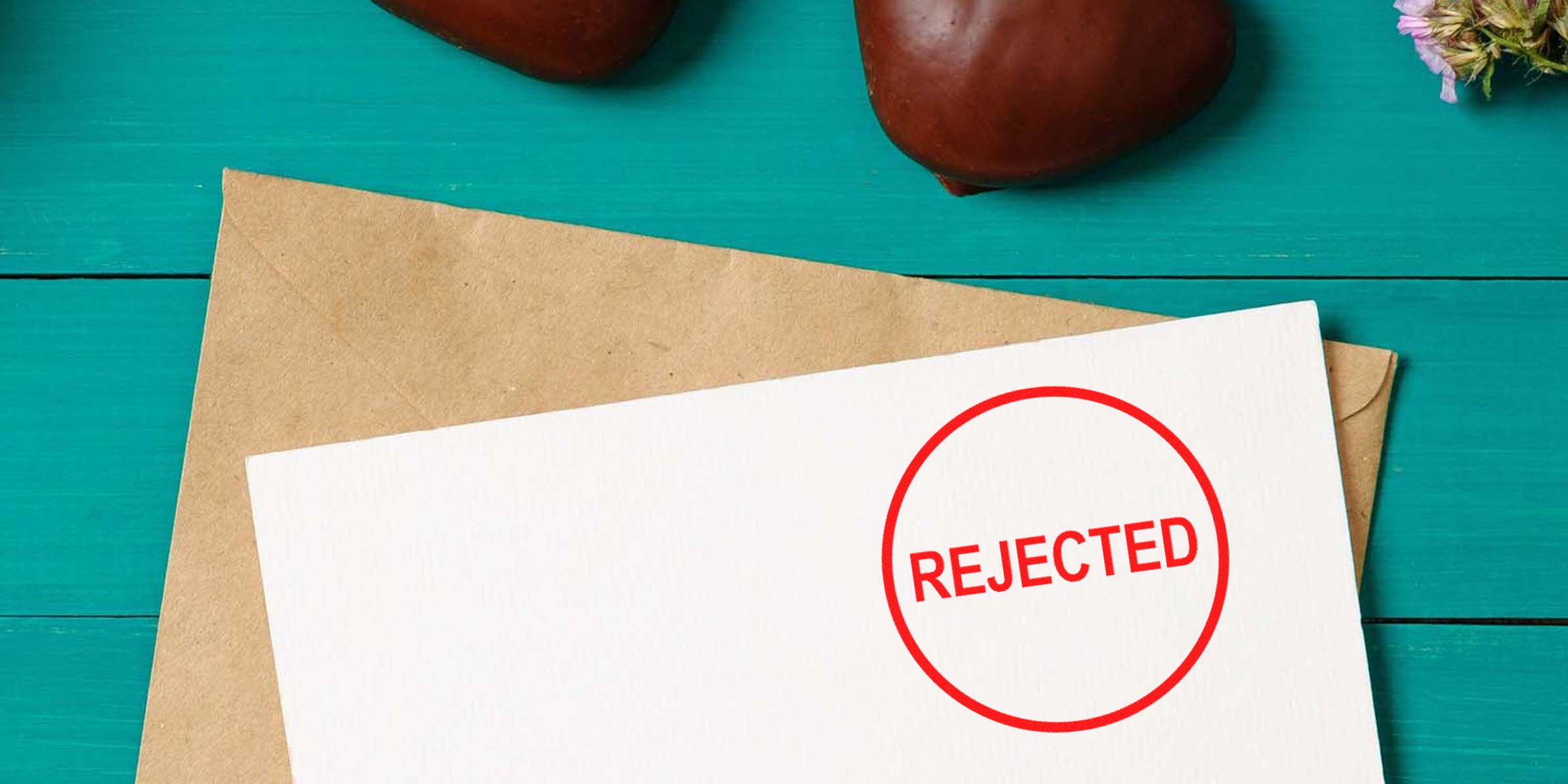 Card with a red “REJECTED” stamp.