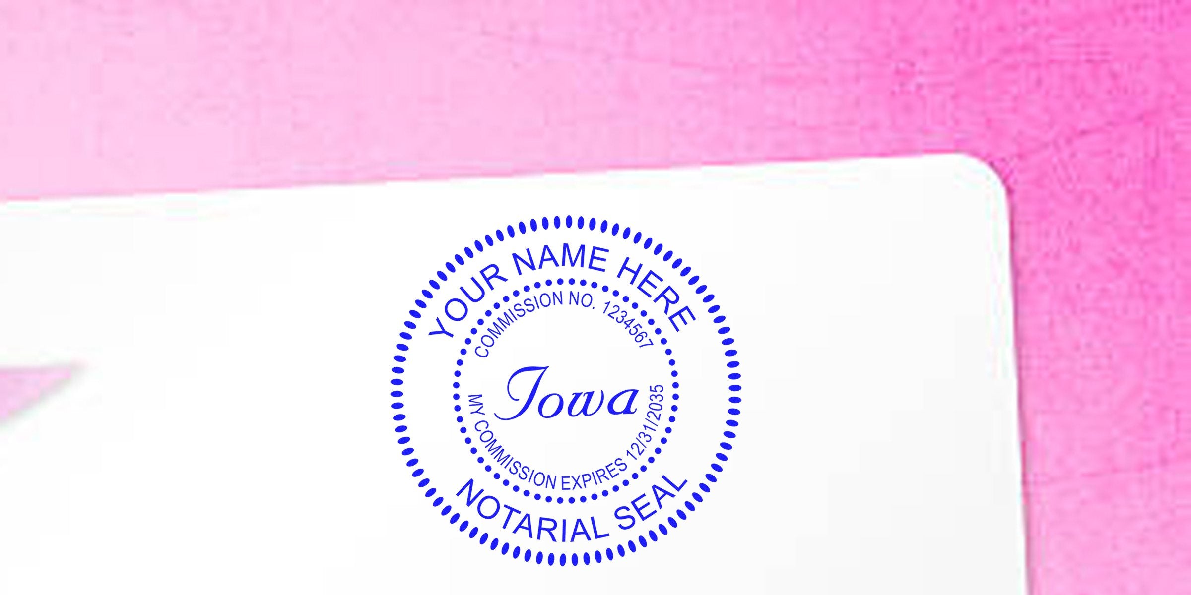 Blue circular Iowa notarial seal stamp mockup reading "Your Name Here," commission number and expiration date, printed on a white card against a pink background