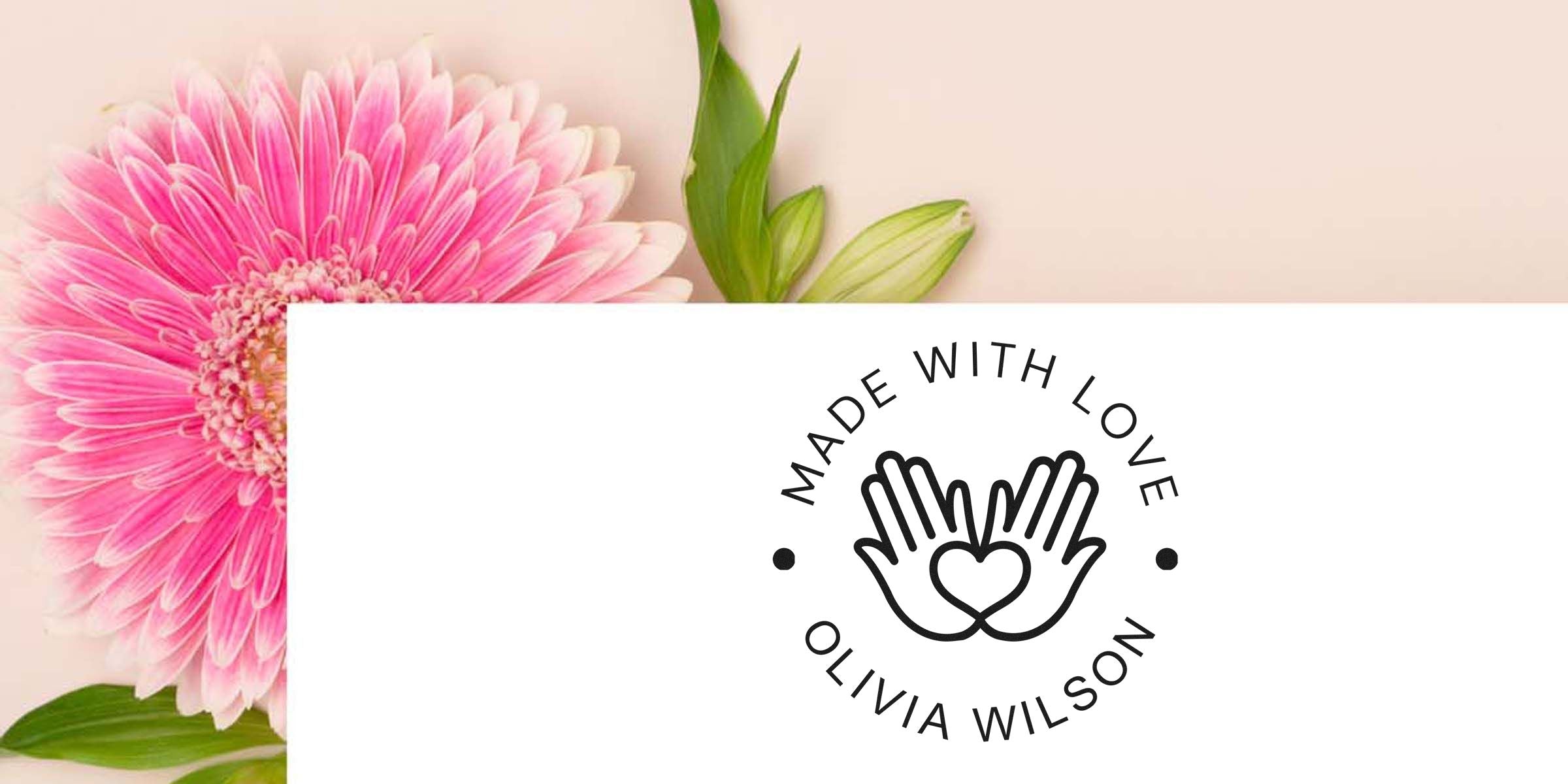 Logo reading “Made with Love” with a heart-winger hands design, over a pink flower background (Olivia Wilson).