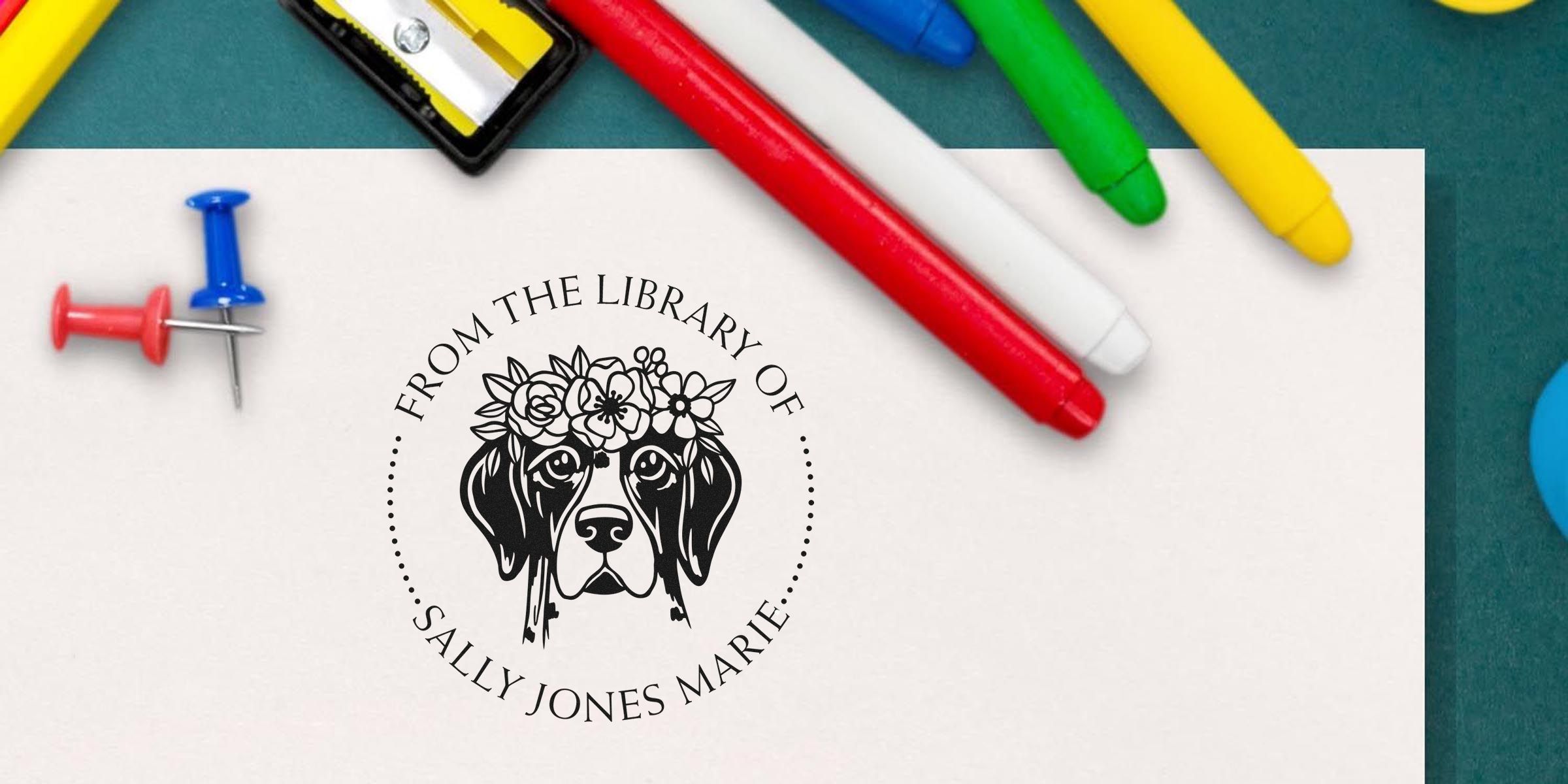 Logo of "From the Library of Sally Jones Marie" featuring a dog head wearing a flower crown, surrounded by circular text.