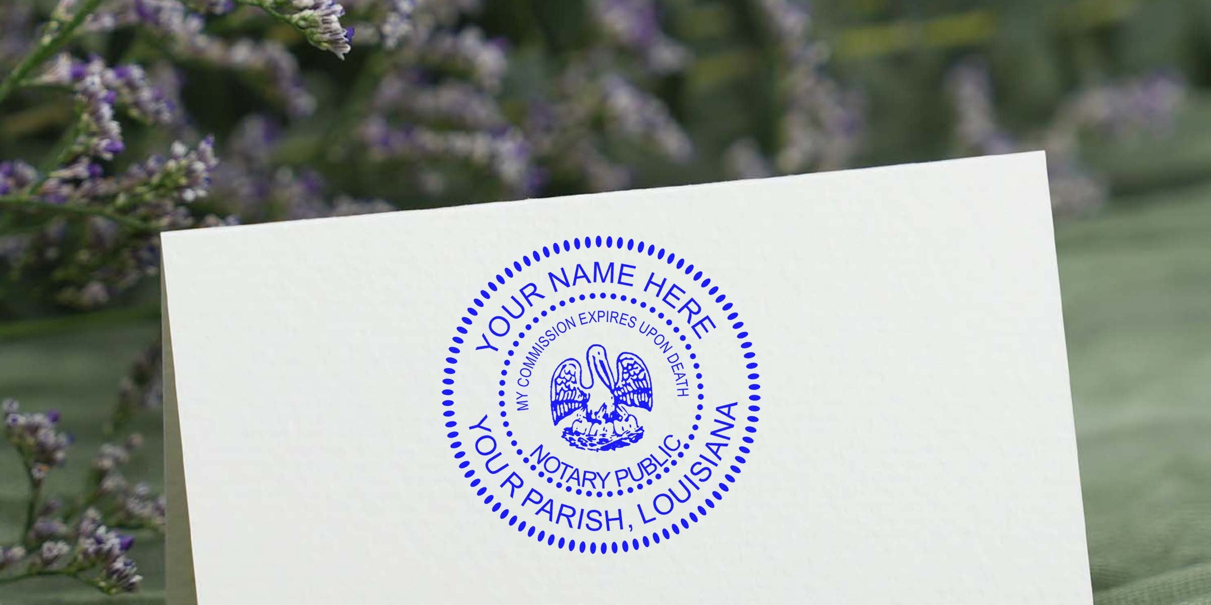 Blue circular Louisiana notary public seal mockup on folded white card with customizable "Your Name Here" and "Your Parish, Louisiana" text, pelican emblem and dotted border, stationery with blurred lavender sprigs background