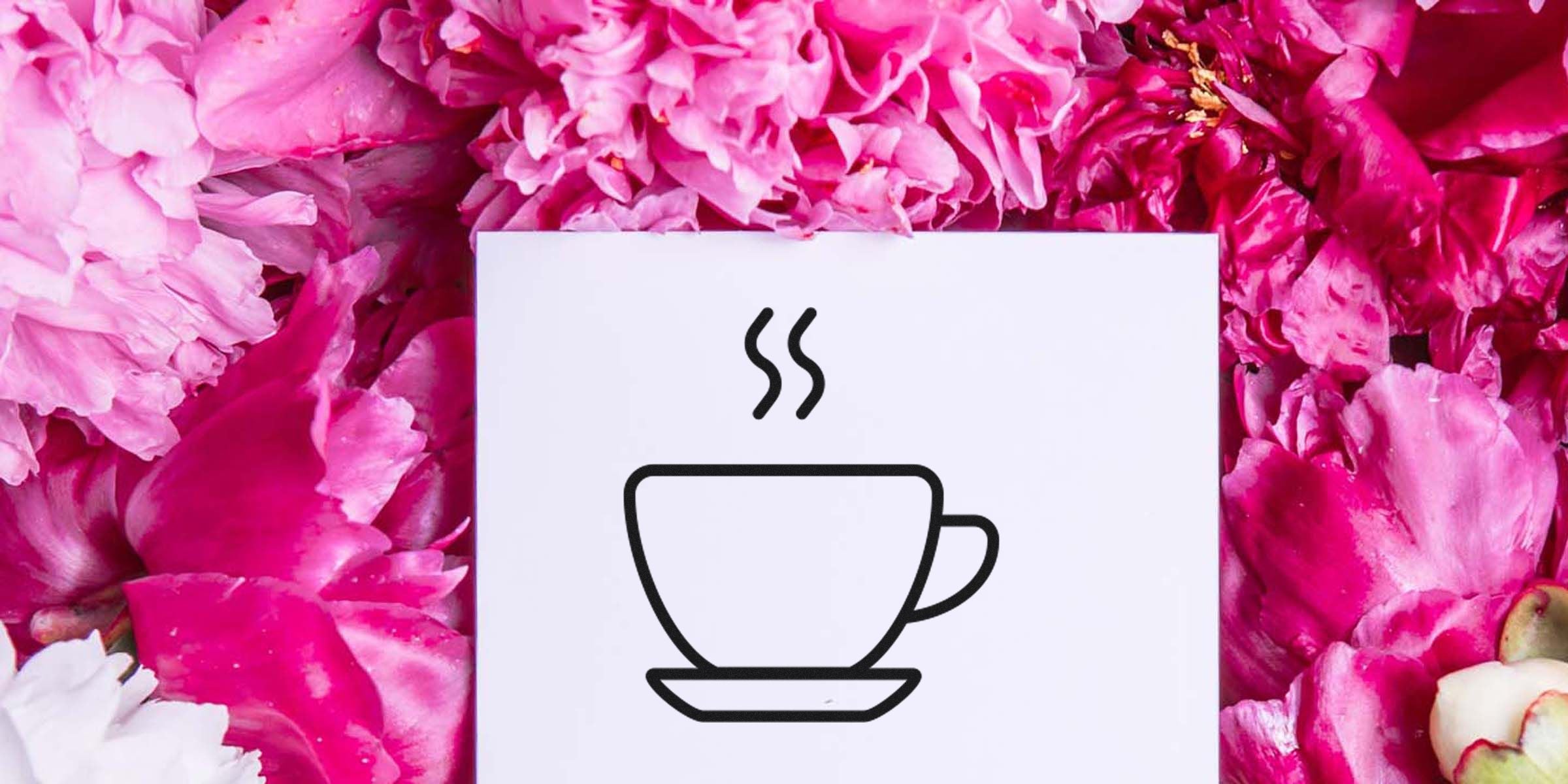 A teacup icon with steam on a white card surrounded by pink petals.