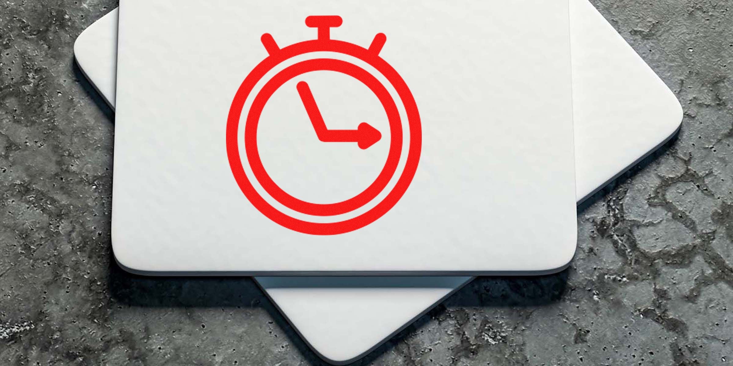 Red stopwatch icon on a white surface with a textured gray background.